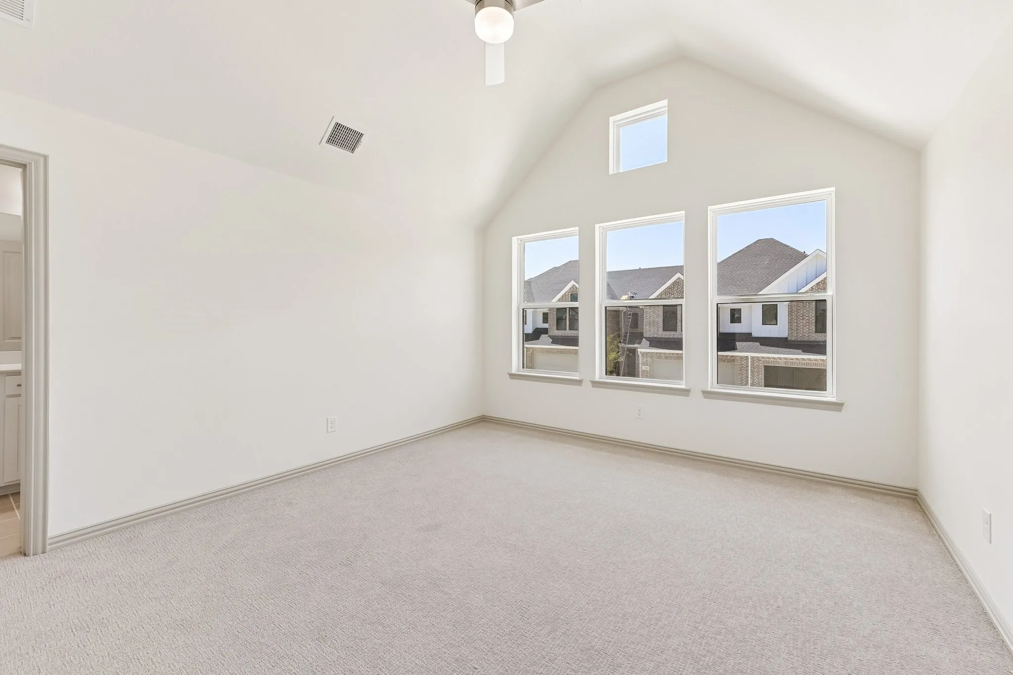 This dreamy, light filled owner's bedroom is the perfect place to relax after a long day.