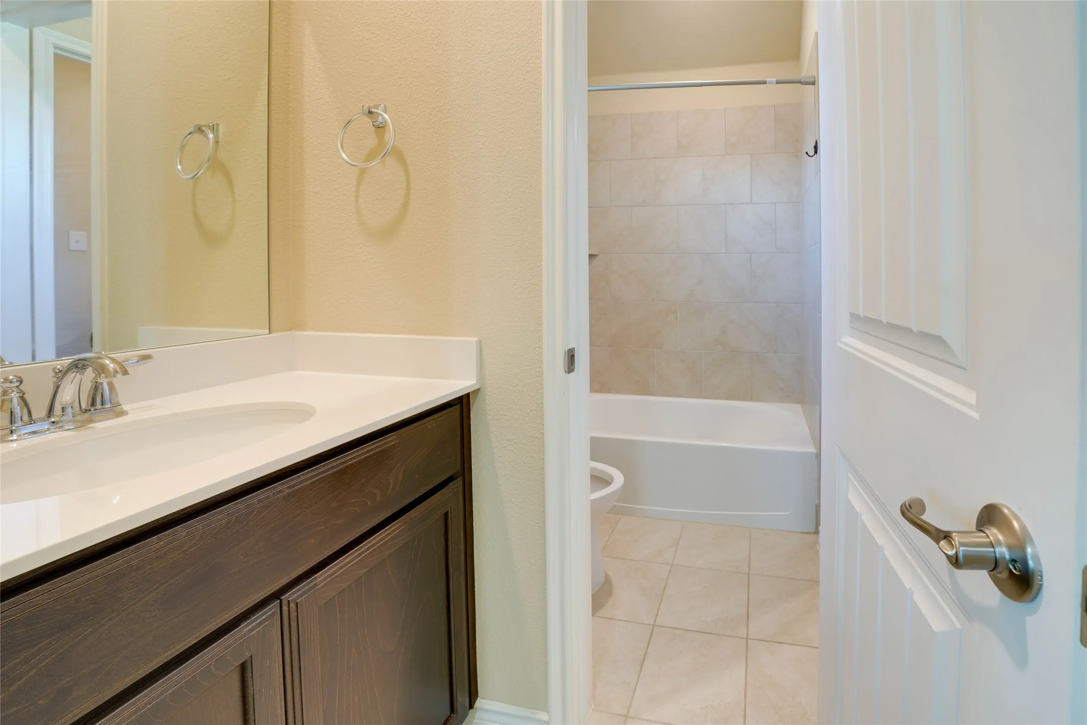 Full bathroom featuring tile patterned floors, vanity, bathing tub / shower combination, and toilet