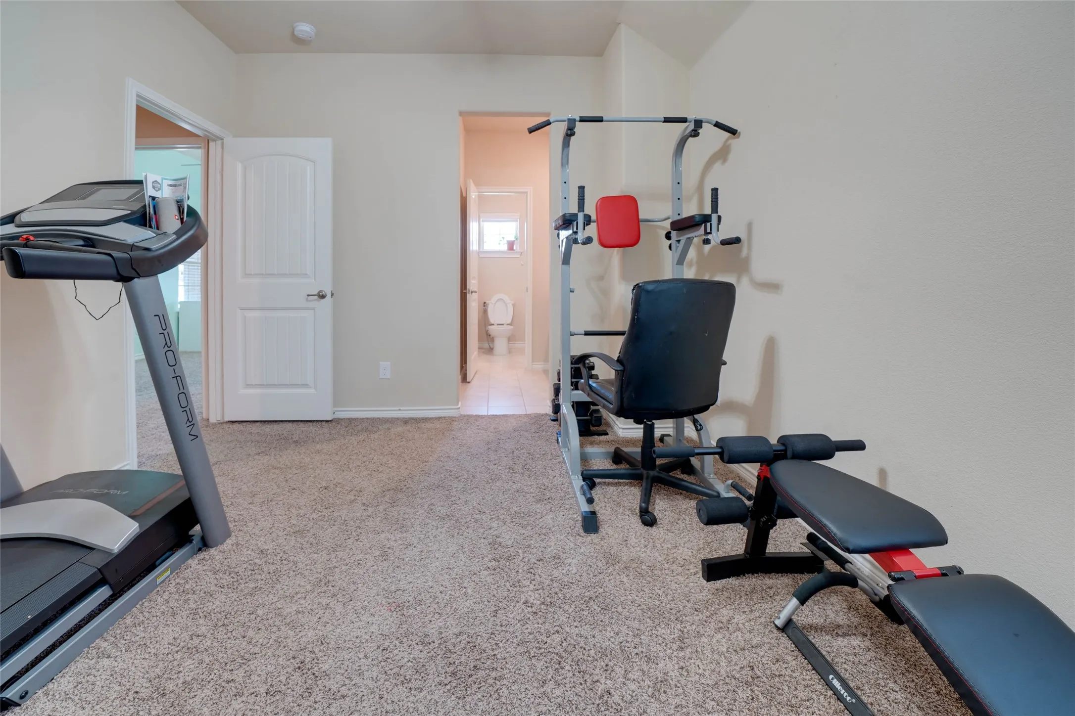 Exercise area with carpet flooring