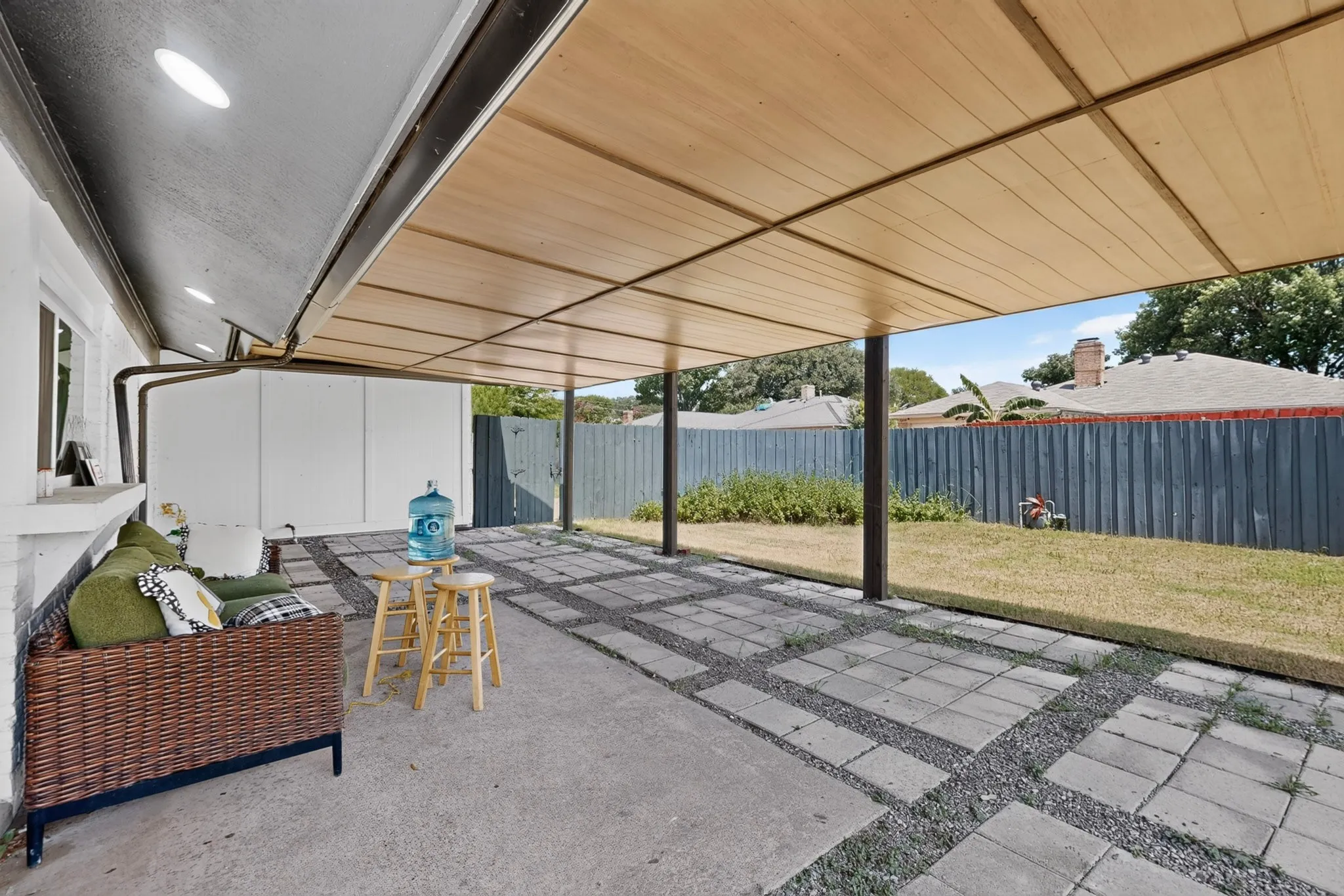 Covered patio featuring a wood-finish ceiling, recessed lighting, and support columns