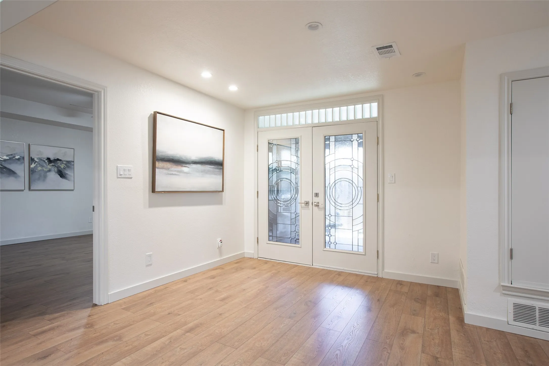 Versatile bonus room off the living area—perfect for a home office, mahjong/game room, cozy den, or reading retreat.
