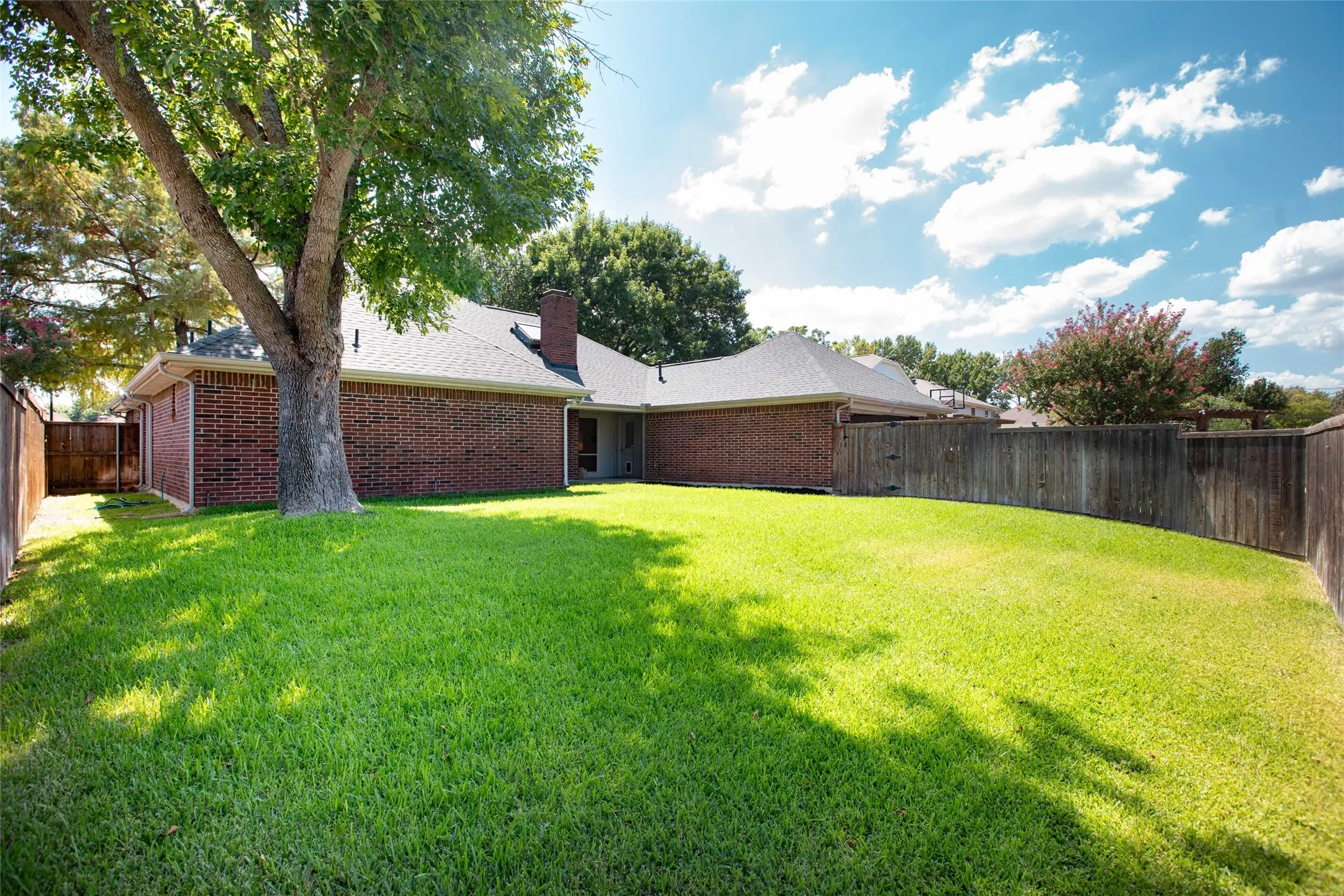 Expansive backyard offering endless possibilities with plenty of space for gardening, play, a future pool, entertaining, or creating your own outdoor oasis.