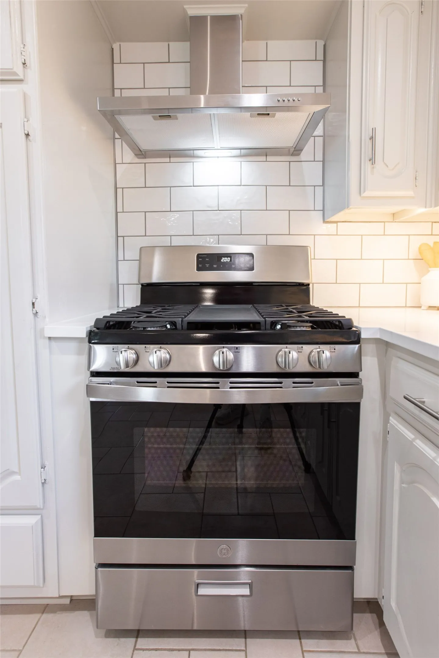 Brand new stainless steel  gas range and hood