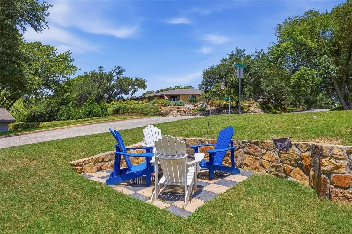 Stone-lined patio area featuring a checkered tile surface