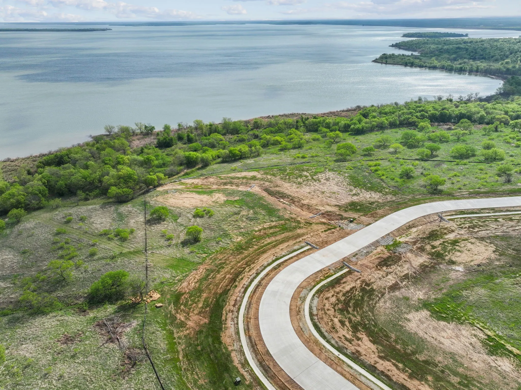 Expansive waterfront property with a new paved road and developing infrastructure