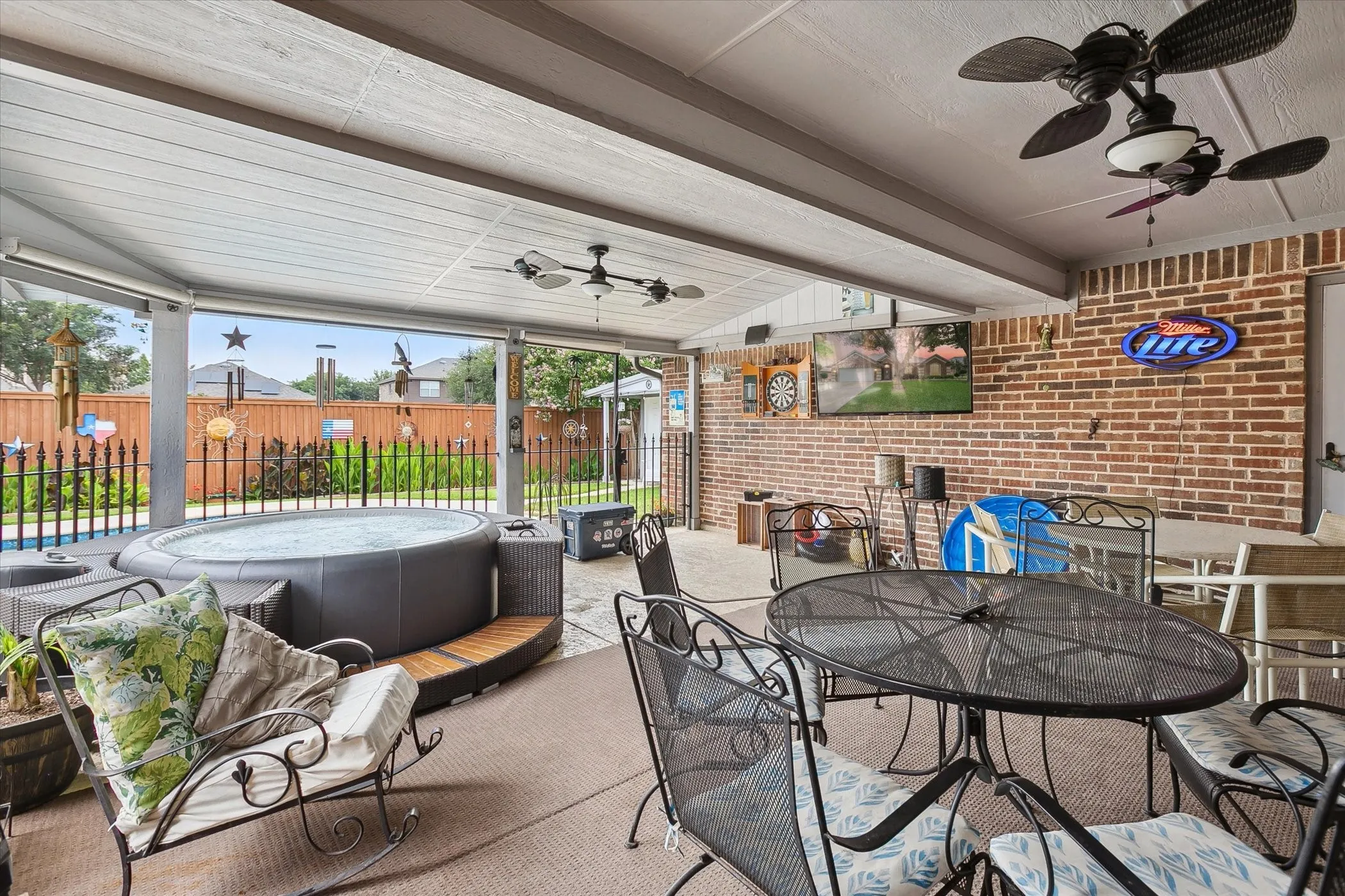 Covered fenced in patio, hot tub is gone.