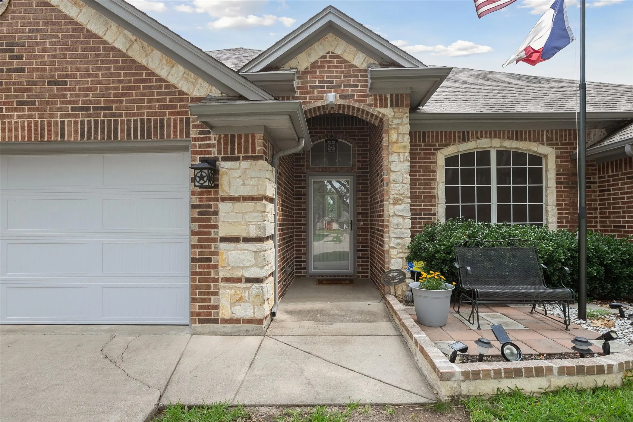 Featuring an arched covered entryway