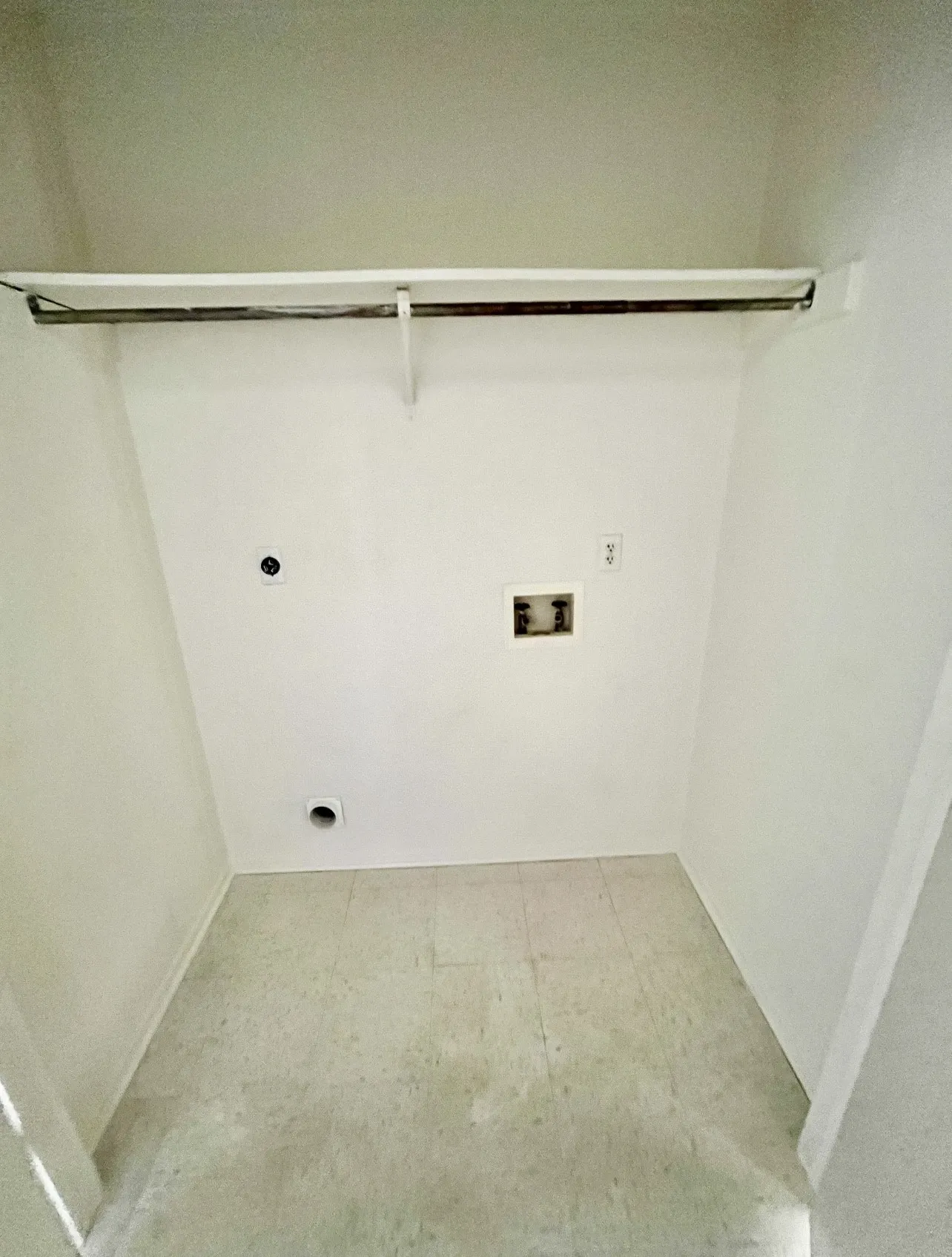 Washroom featuring hookup for an electric dryer, hookup for a washing machine, and tile patterned floors