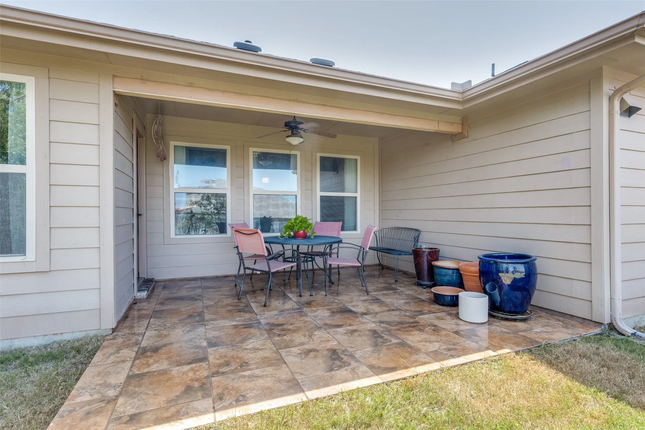 Enjoy this summer with a covered & extended patio with a fan