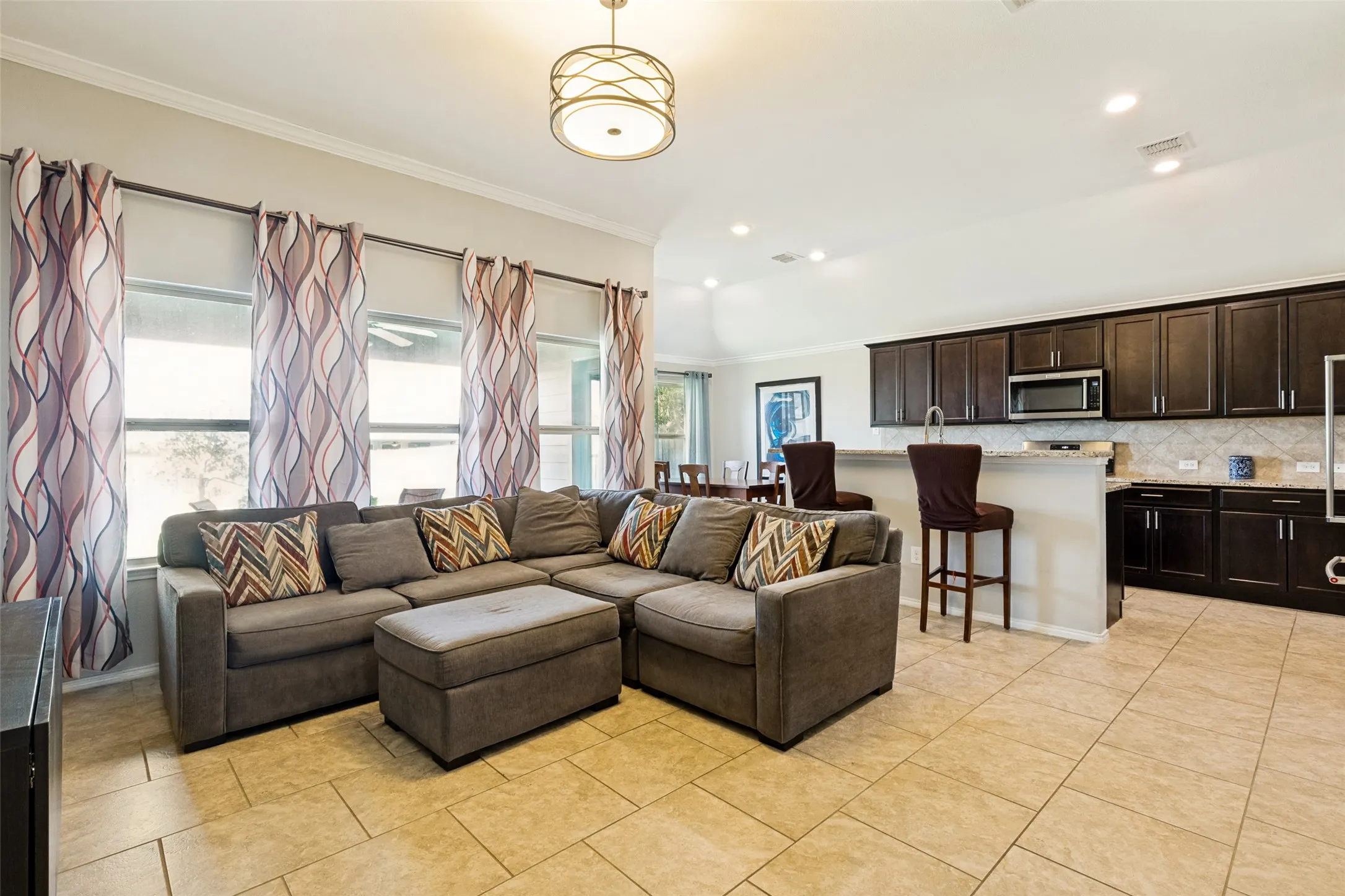 Open living, kitchen, and dining at the center fo the home