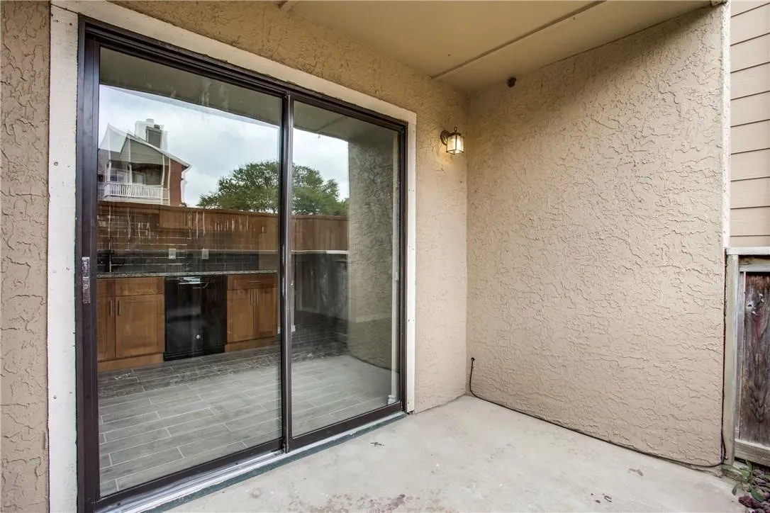 Doorway to property with a patio