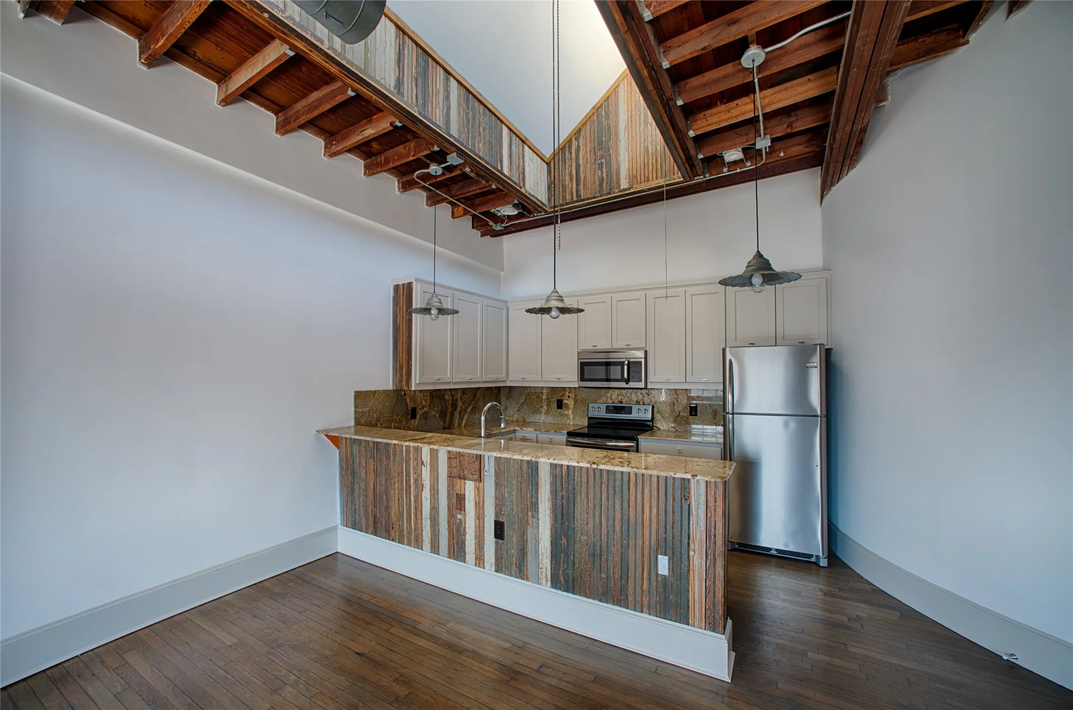 Unit 217 - Modern kitchen. Wonderful natural light comes in via the skylight right above the kitchen
