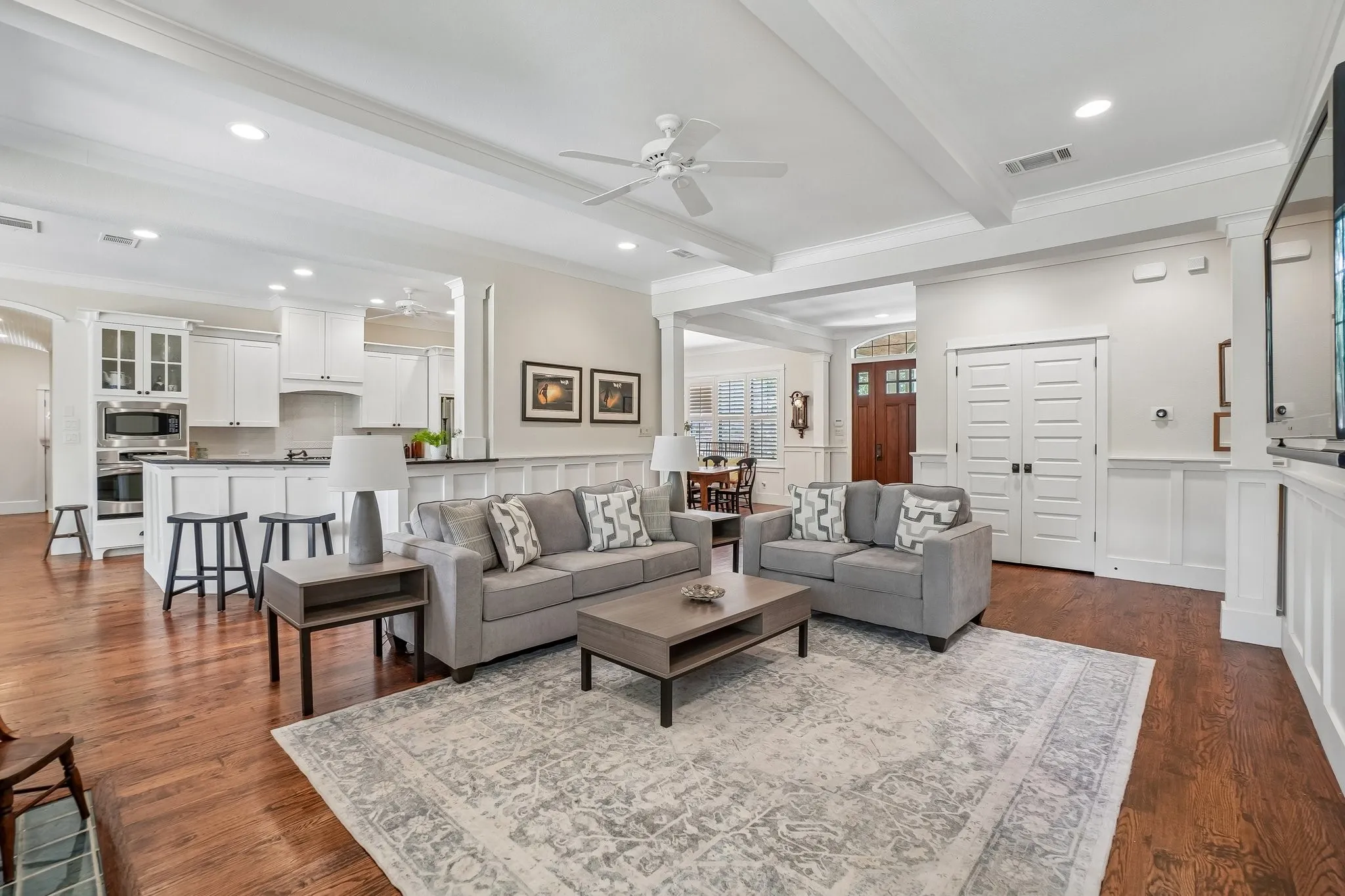 Open-concept living space with dark wood-finish flooring