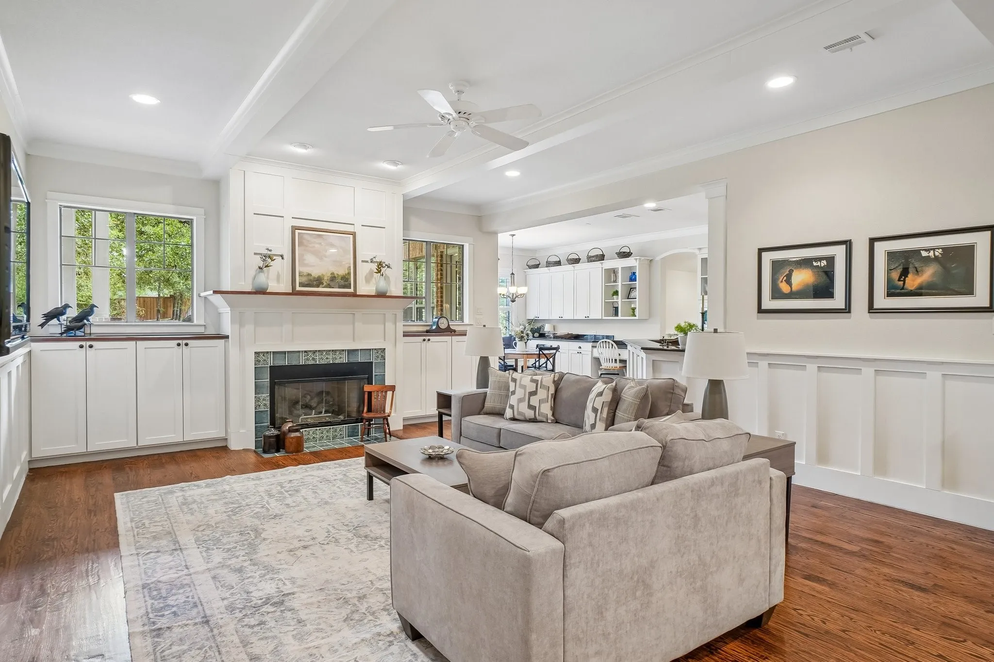Living area featuring wood-finish flooring, recessed lighting, and a ceiling fan