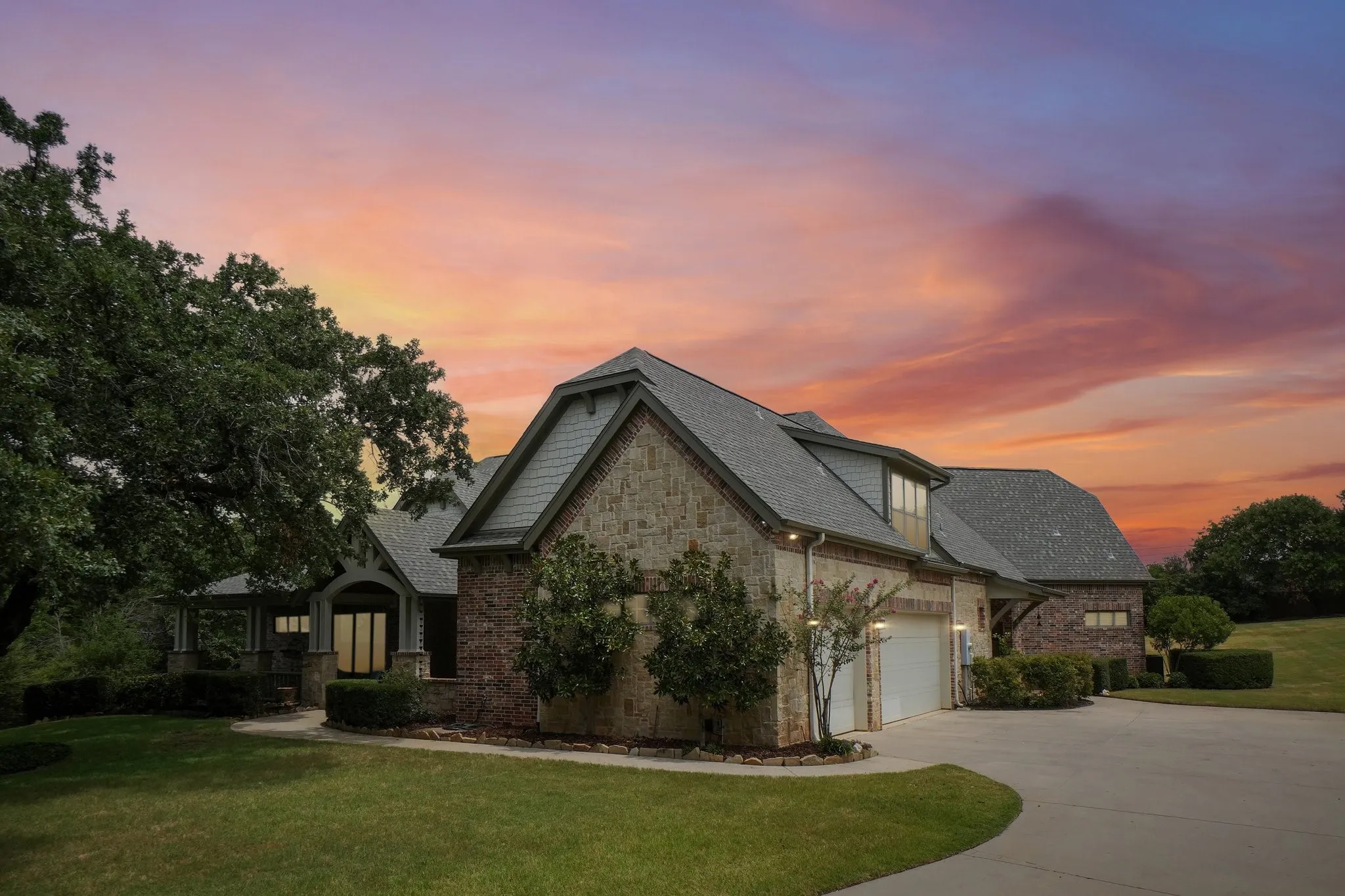 Stone and brick exterior with a multi-gabled roofline
