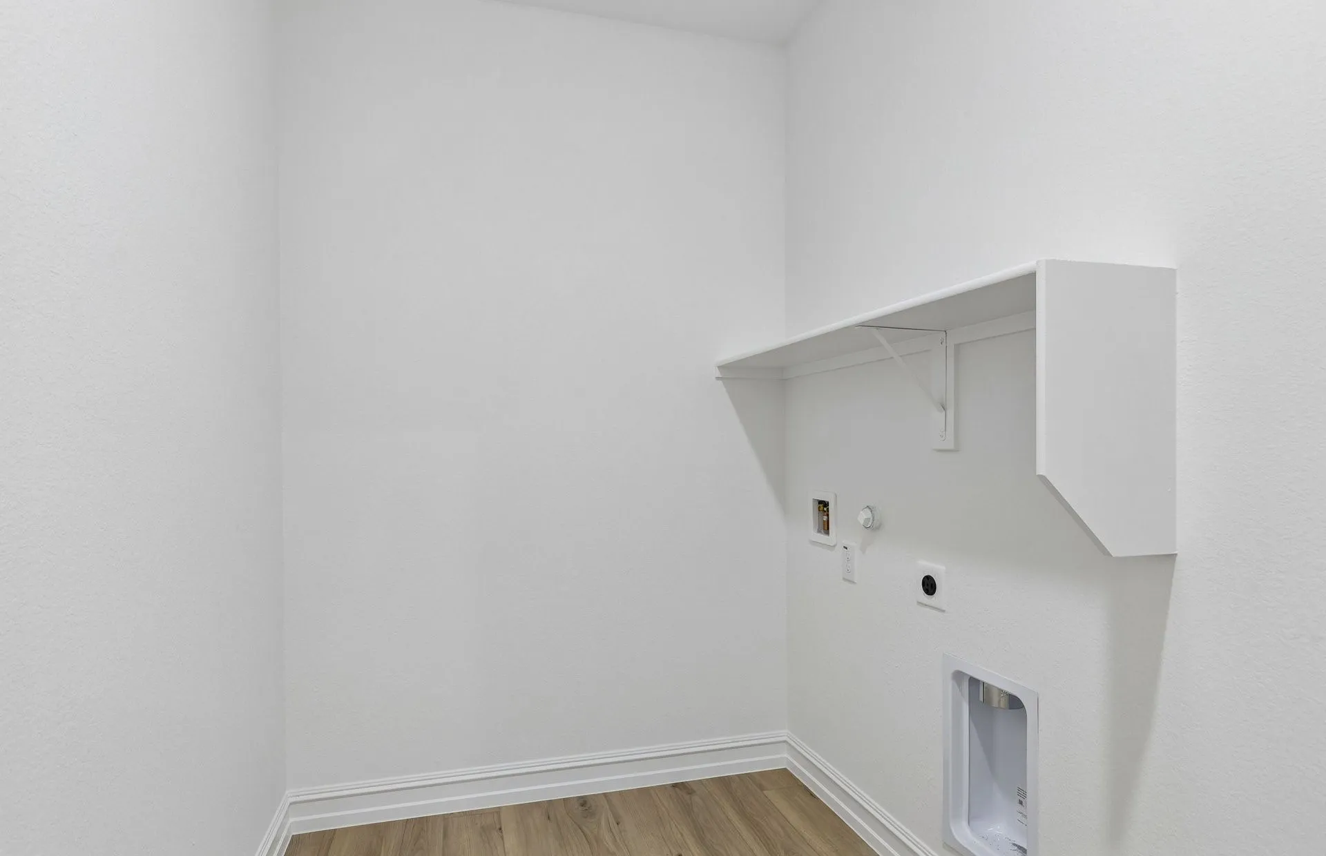 Laundry room with built-in shelving