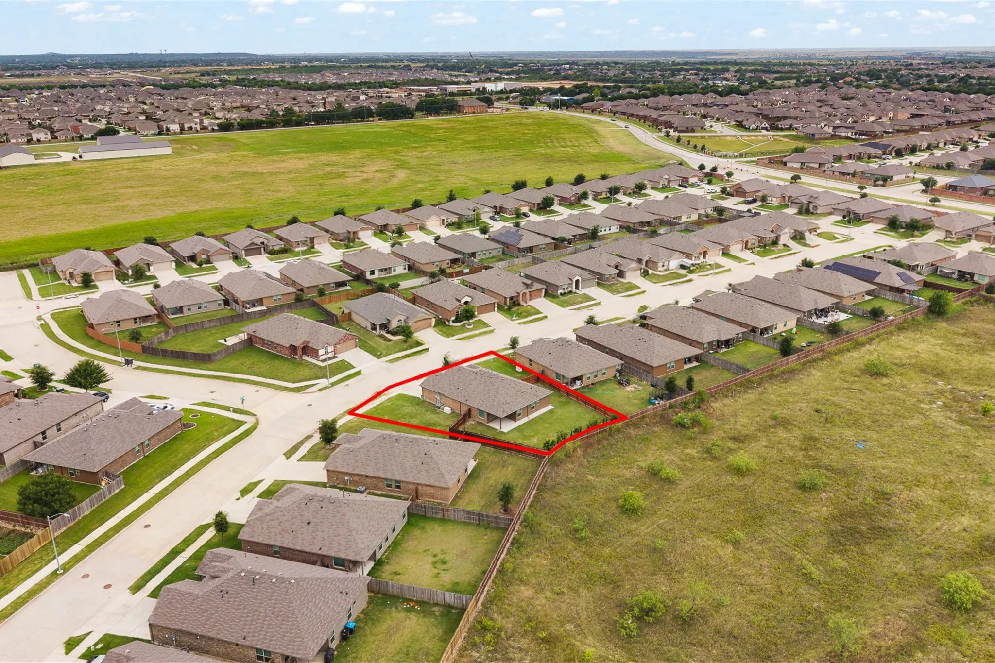 Single-story property with a fenced backyard situated within a developed residential community