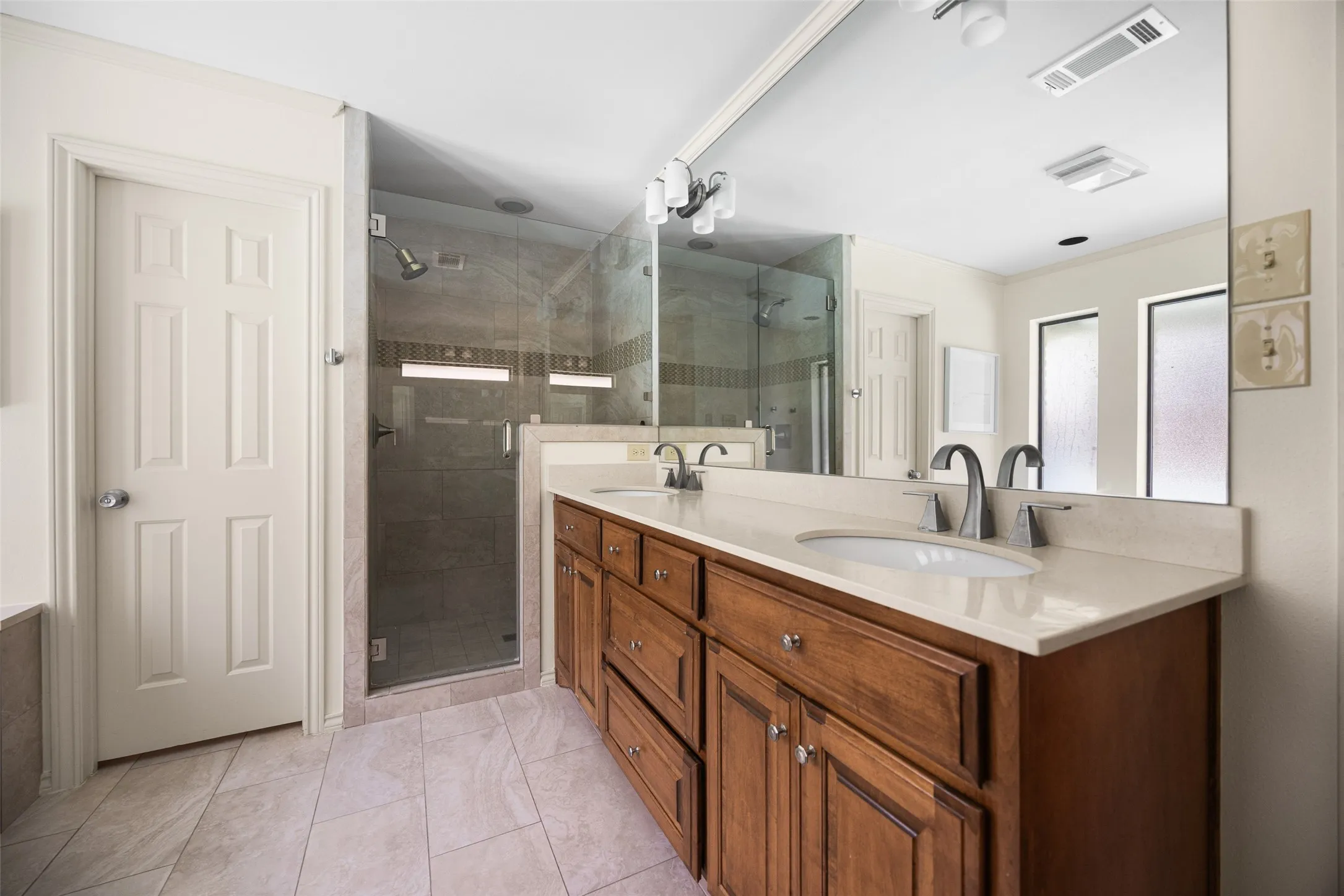 Dual vanity with integrated sinks and brushed nickel fixtures