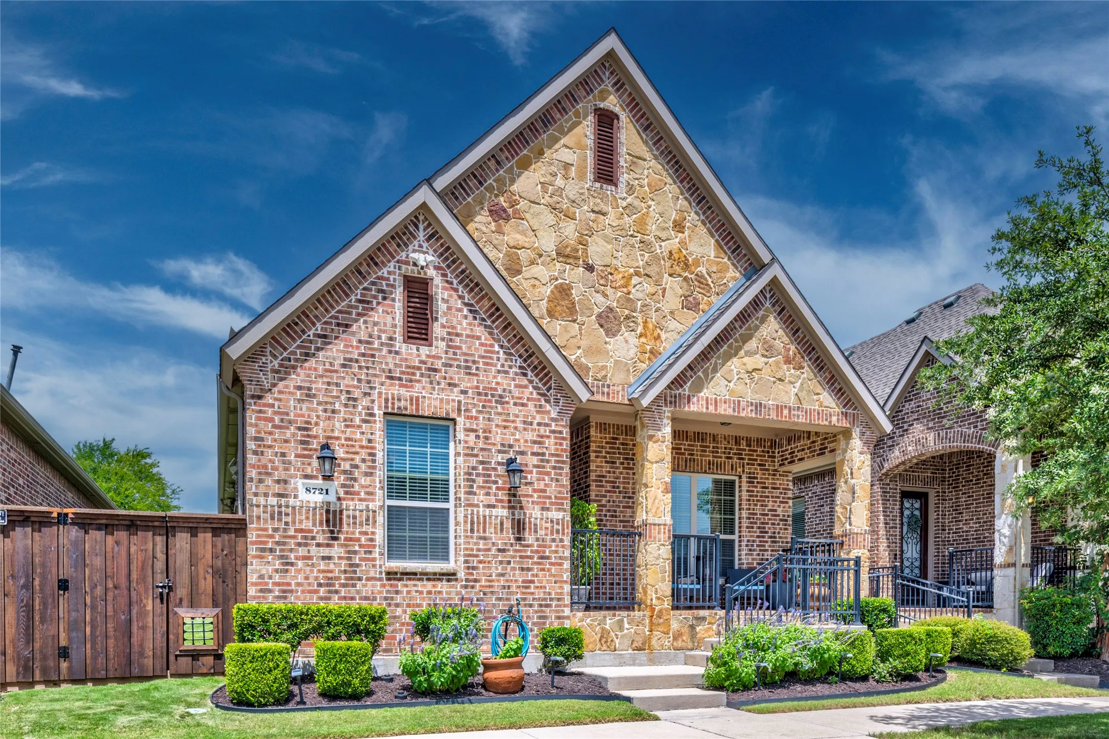Upgraded front facade with stone and brick! Board on board cedar fence with gate for easy side yard entry.