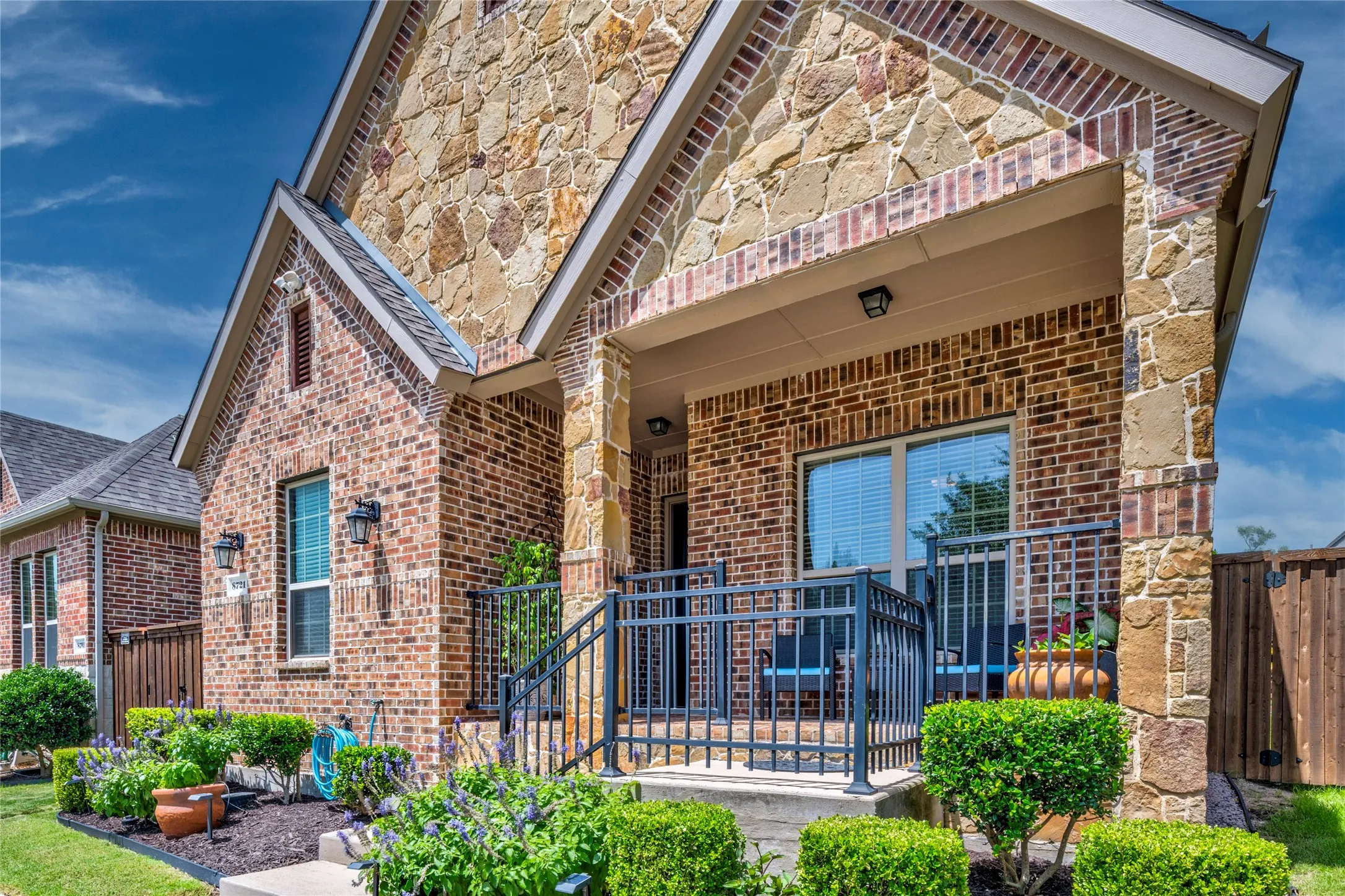 Decorative metal porch railing for added appeal.