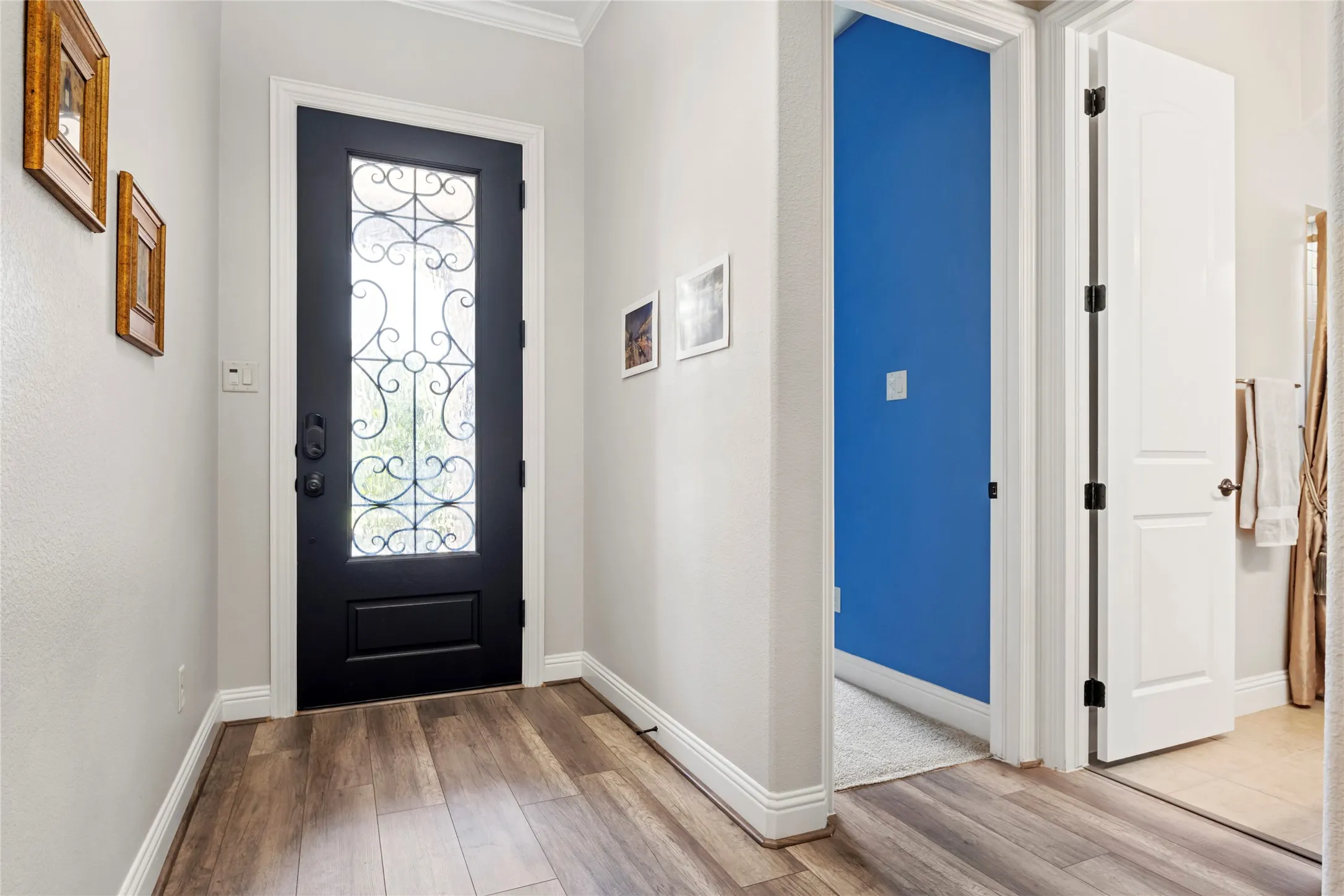 Easy-care LVP flooring!  The blue in this bedroom is more subtle in real life!  The photo editing exaggerates the color.