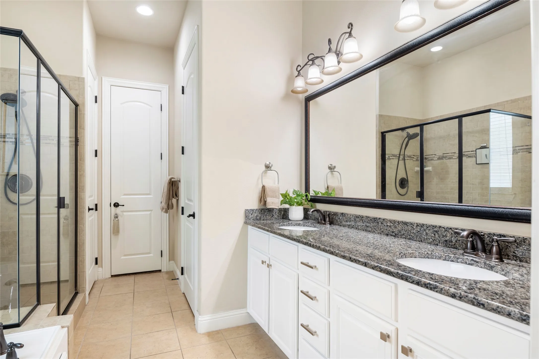 Primary bathroom features granite counters, dual sinks, garden tub, separate shower, linen closet, and walk-in closet.