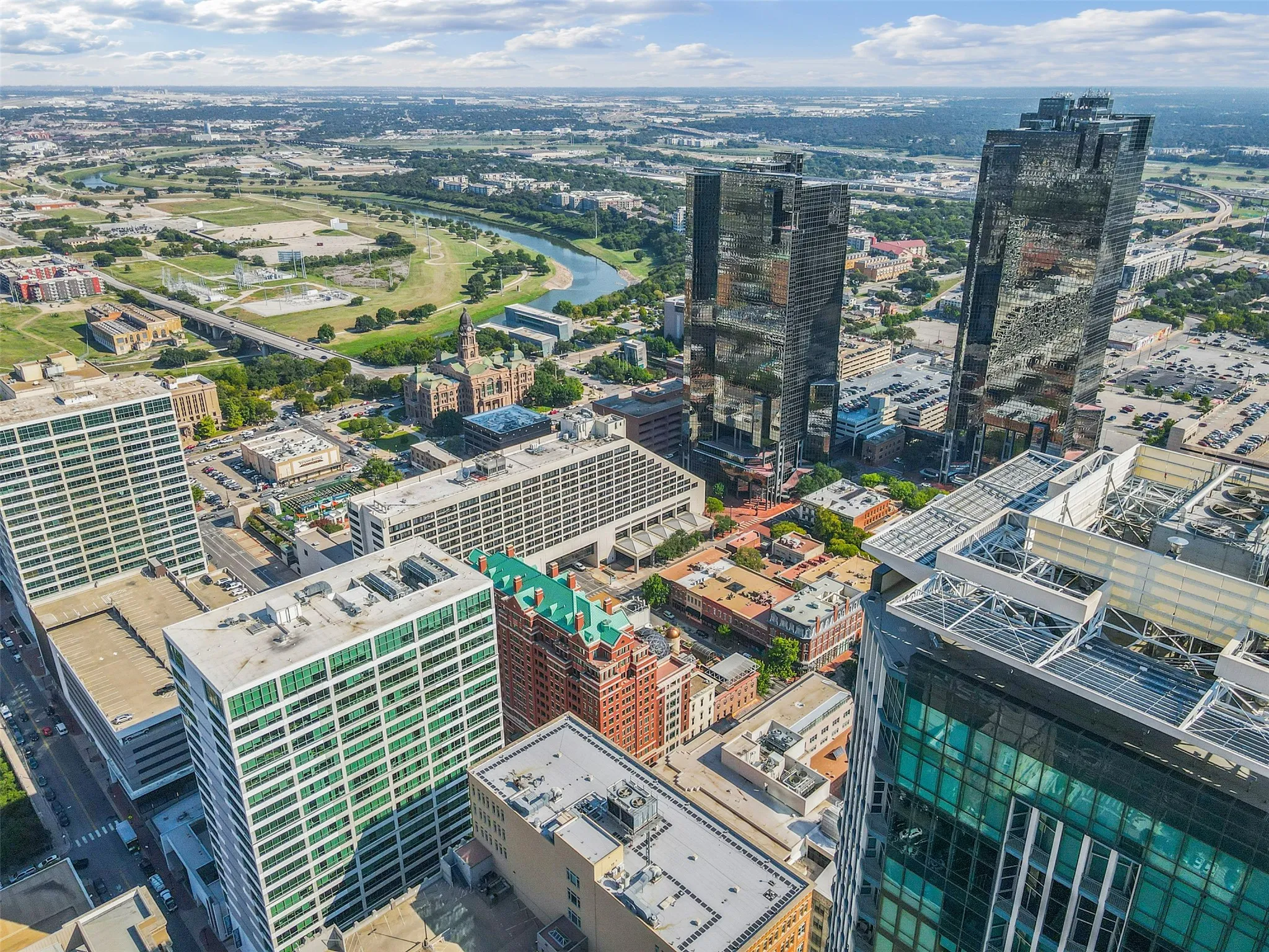 Urban landscape featuring multiple high-rise buildings with reflective glass facades