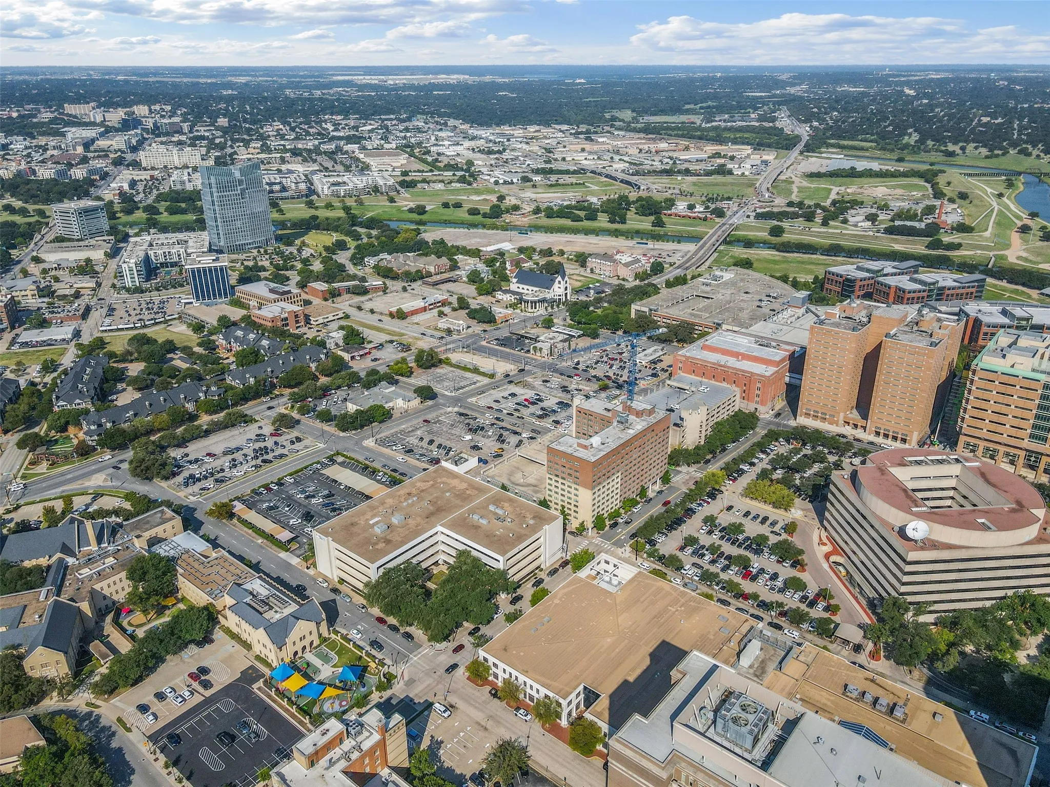 Aerial perspective showcasing a dense urban landscape with commercial and residential buildings