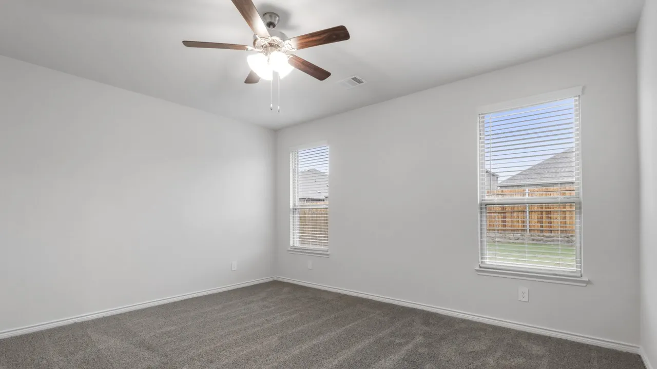 Neutral paint palette throughout, featuring plush gray carpeting and white trim