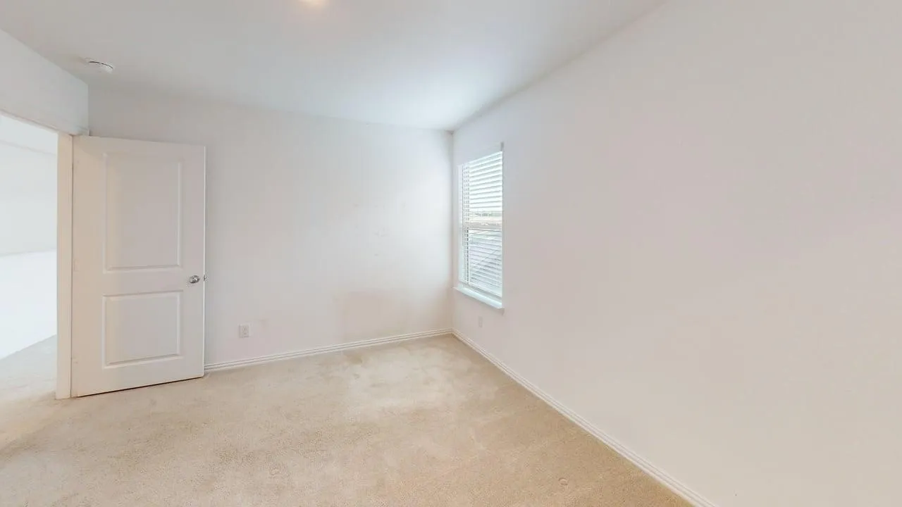 Neutral-toned carpeting defining a spacious interior