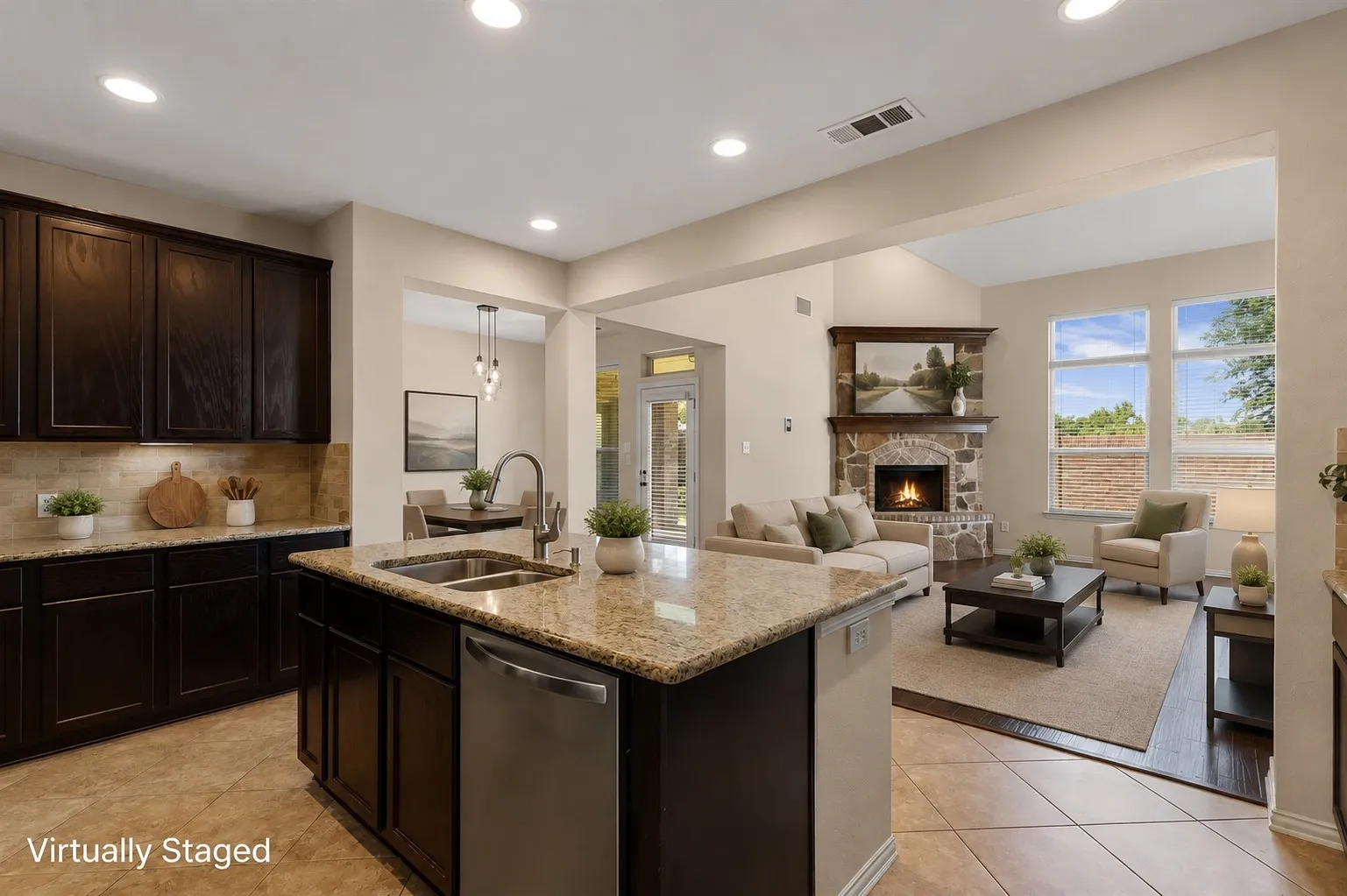 Kitchen island with a double basin sink and stainless steel dishwasher