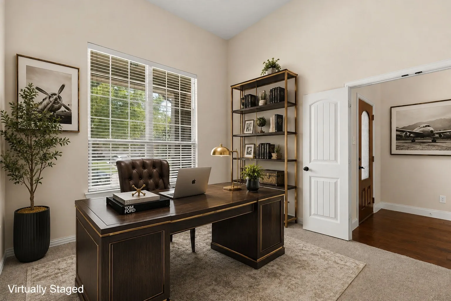 Vaulted ceiling, large double window with blinds, carpeted flooring, white paneled door, and a wide entryway