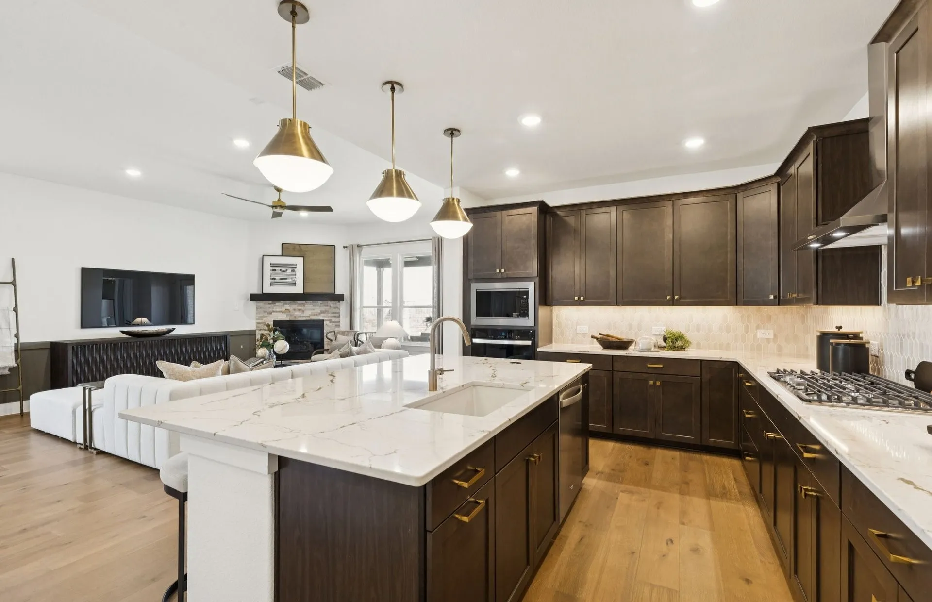 *Model Representation - Large island overlooking gathering room and dining areas