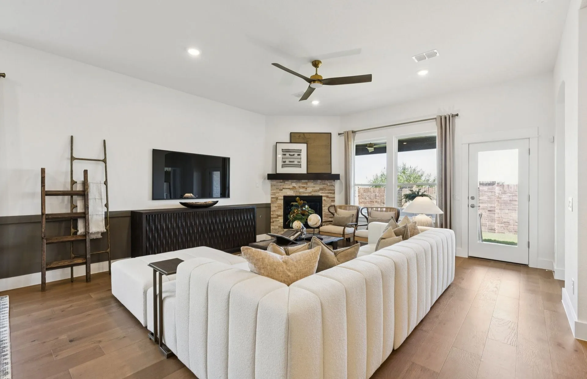 *Model Representation - Spacious gathering room with large windows