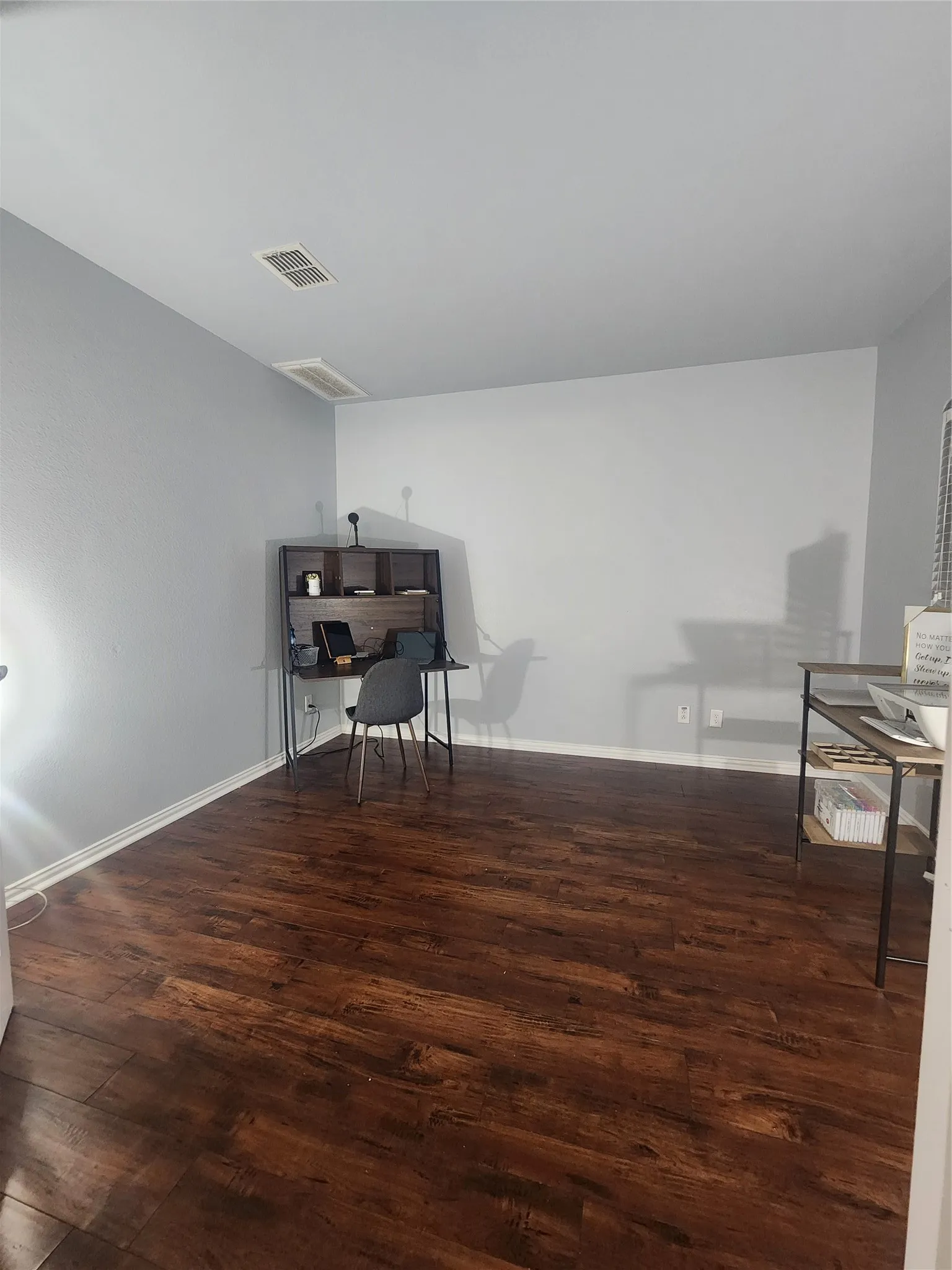 Office, wood finish flooring. Can be used as a third bedroom or felx space