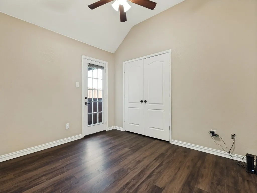 1st Bedroom or could be an office if needed.  Door leads to Large covered patio/outdoor living space adjacent to Pool