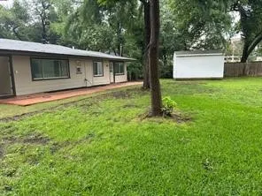 View of yard with a storage shed