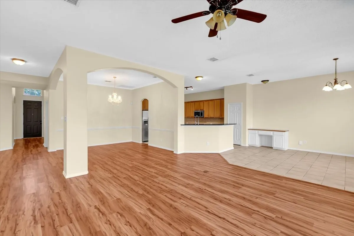 Living area view to dining room and hallway