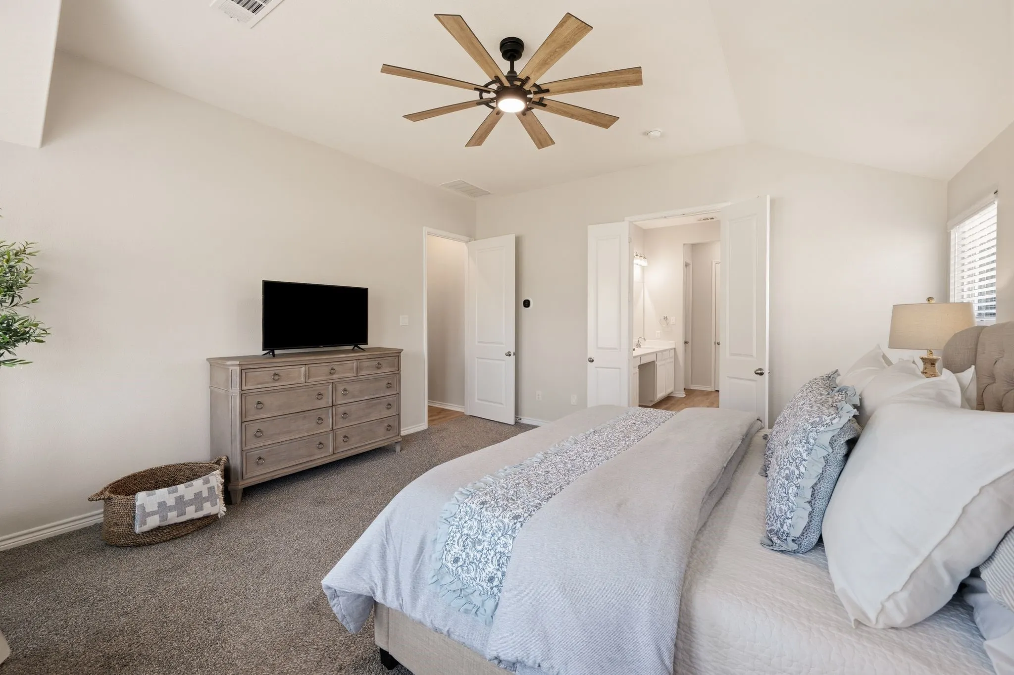 Vaulted ceiling featuring a contemporary ceiling fan with light fixture
