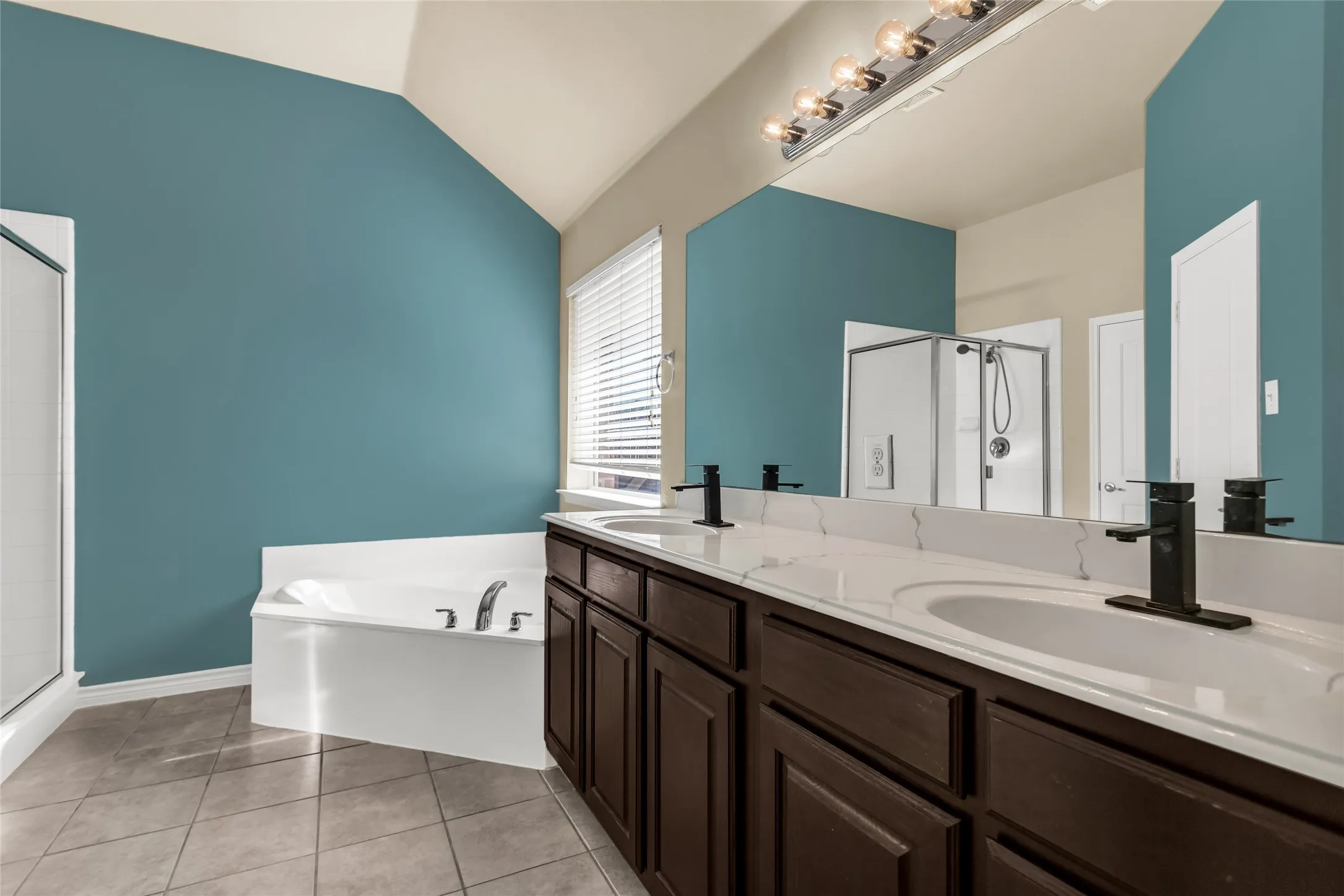Dark wood cabinets with tile floors