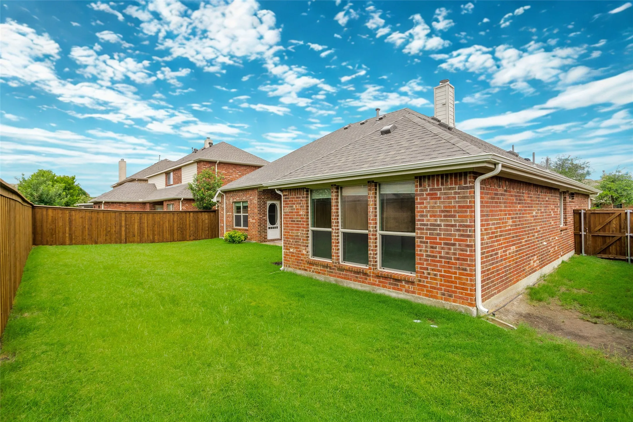 Large backyard great for family entertainment. Room for pool, grill and firepit.