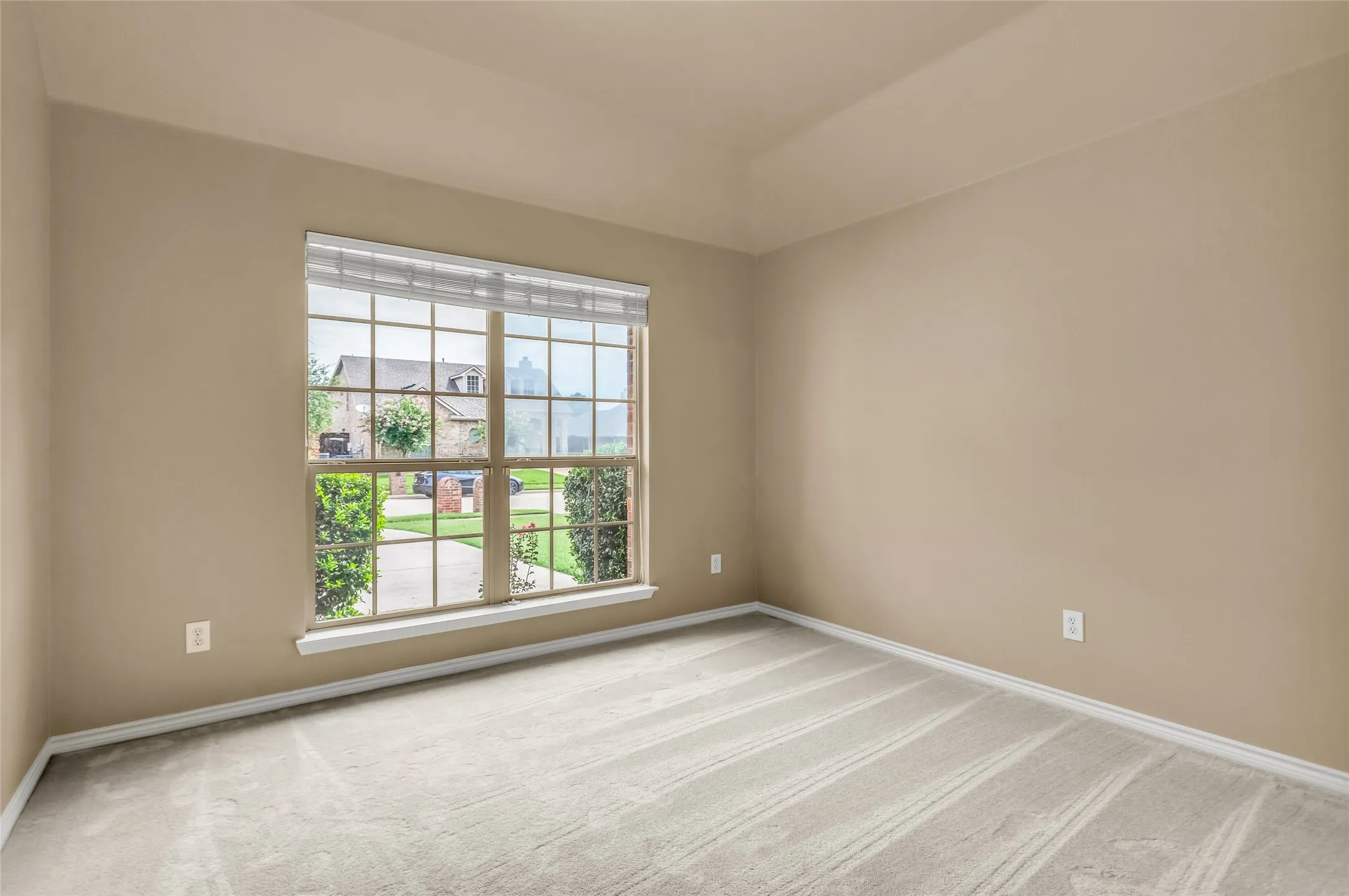 Carpeted bedroom 3 room with baseboards