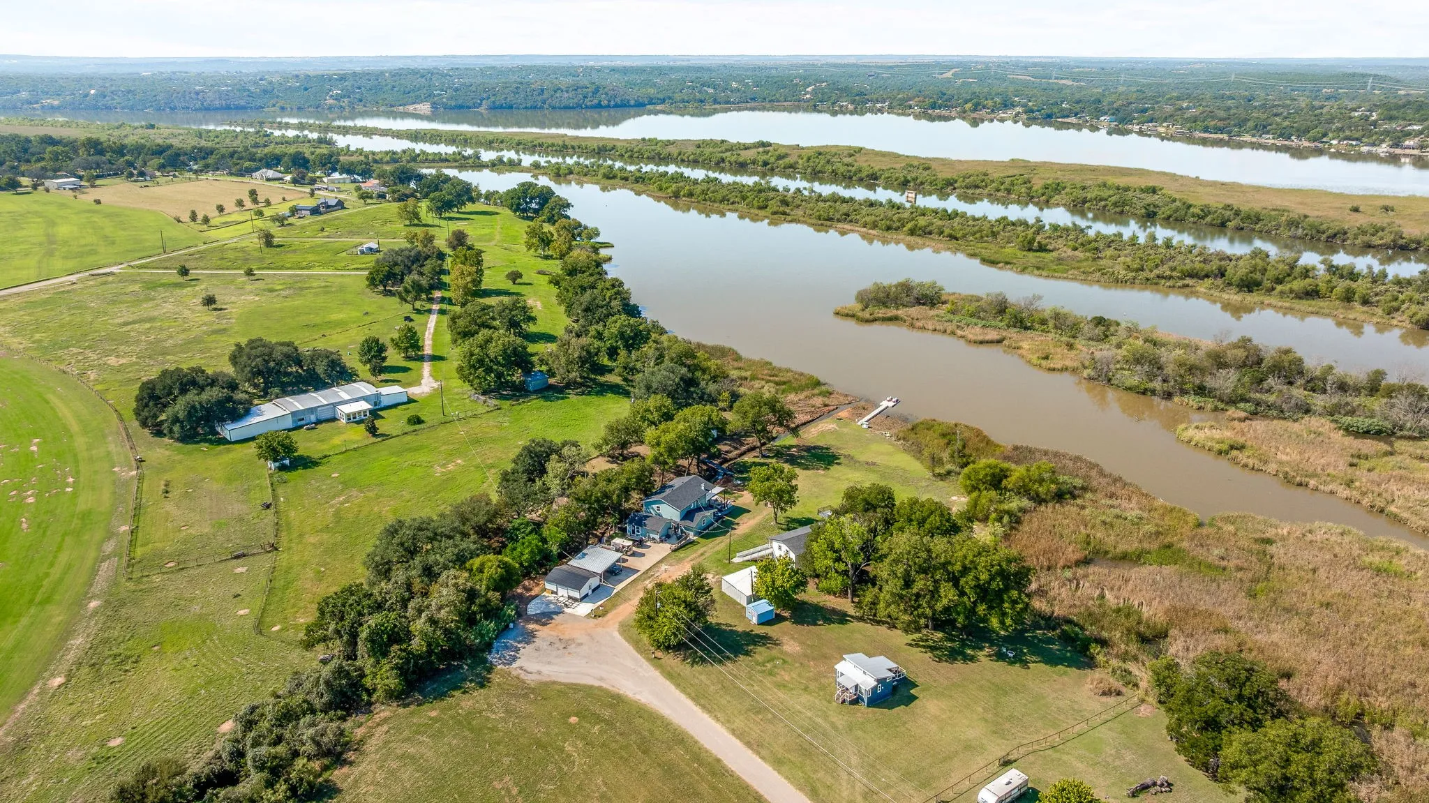 Aerial view of sparsely populated area with a large body of water