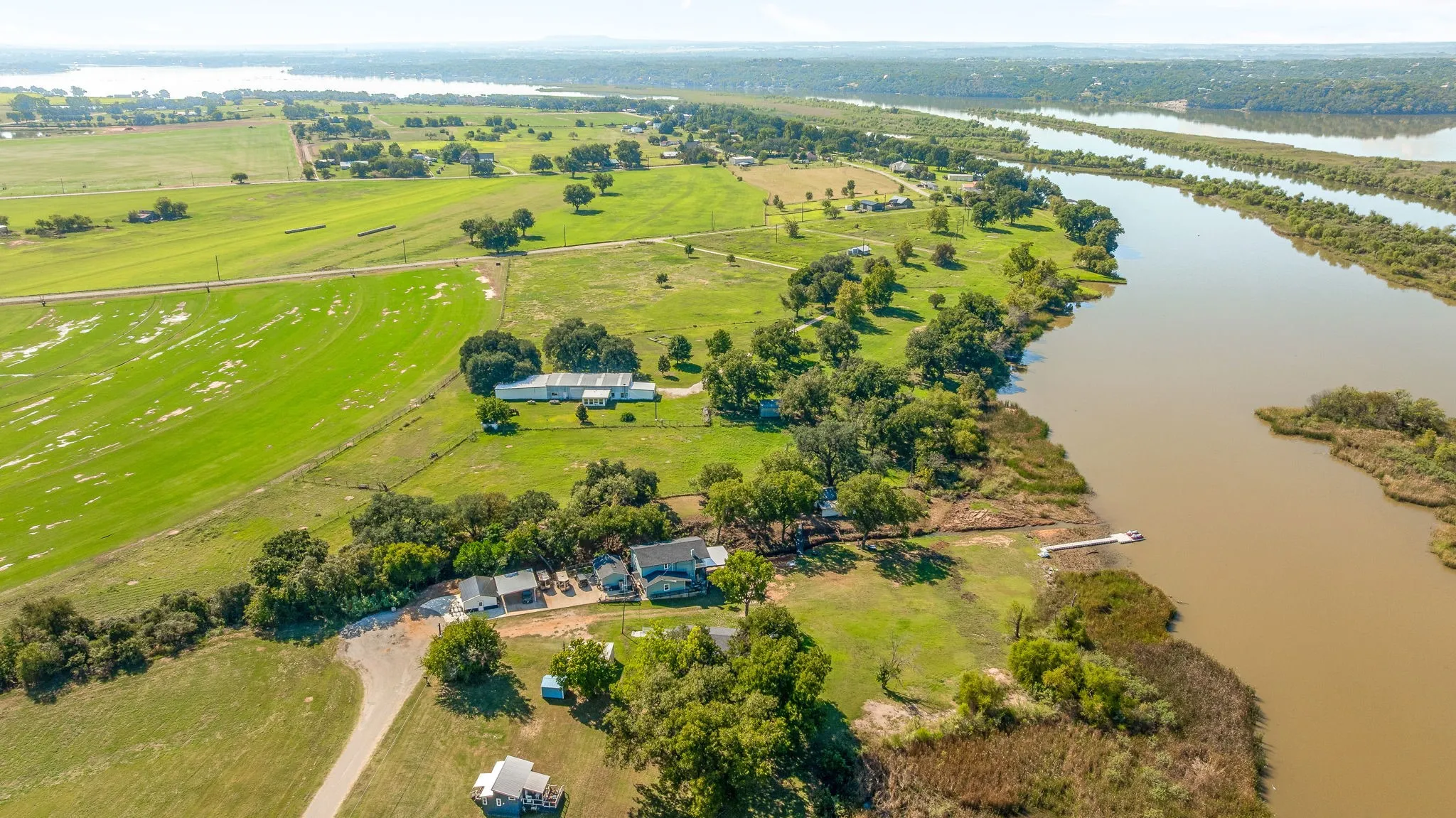 Overview of rural landscape featuring a nearby body of water
