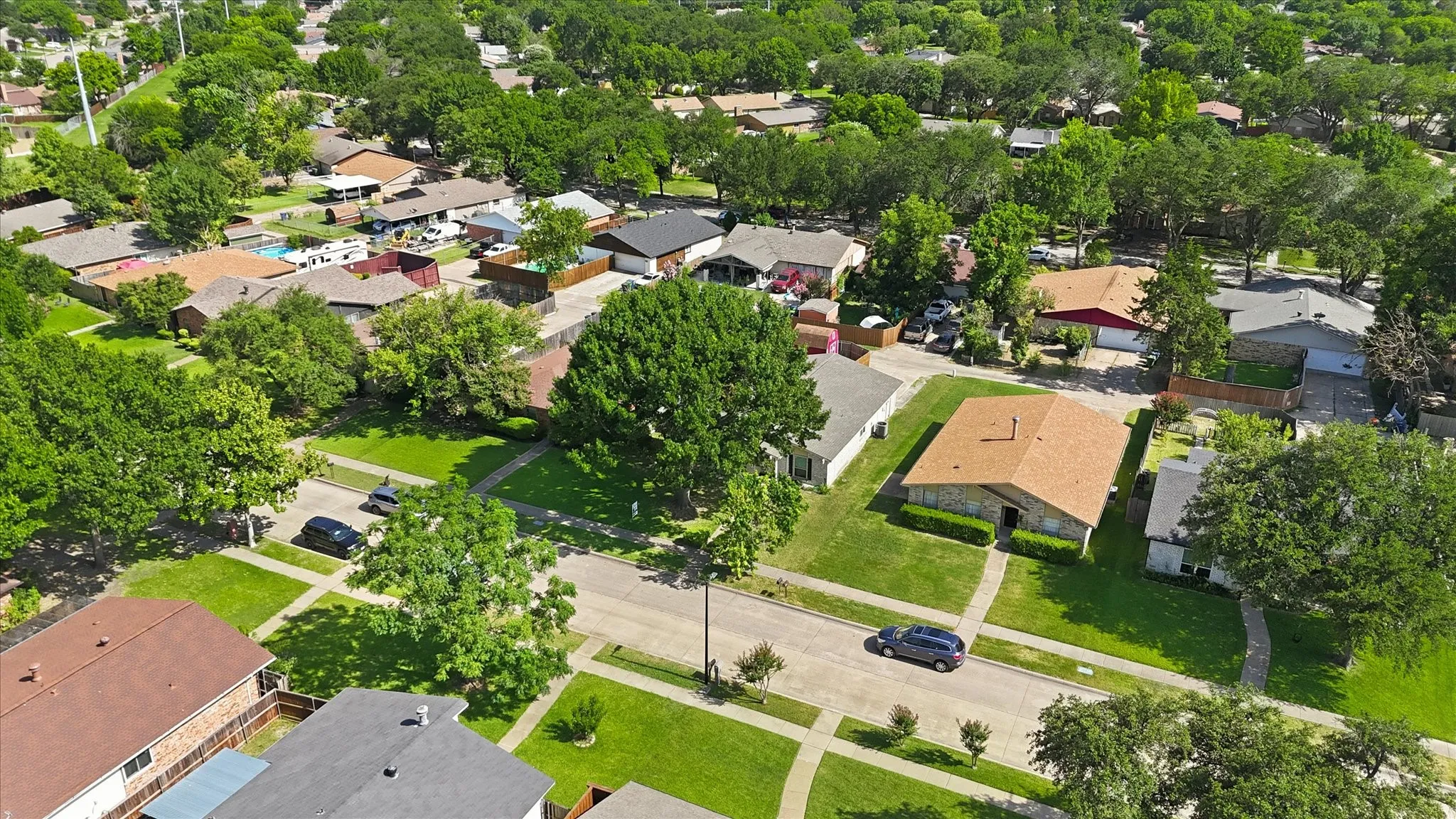 Tree lined street with sidewalks. Well maintained neighborhood.