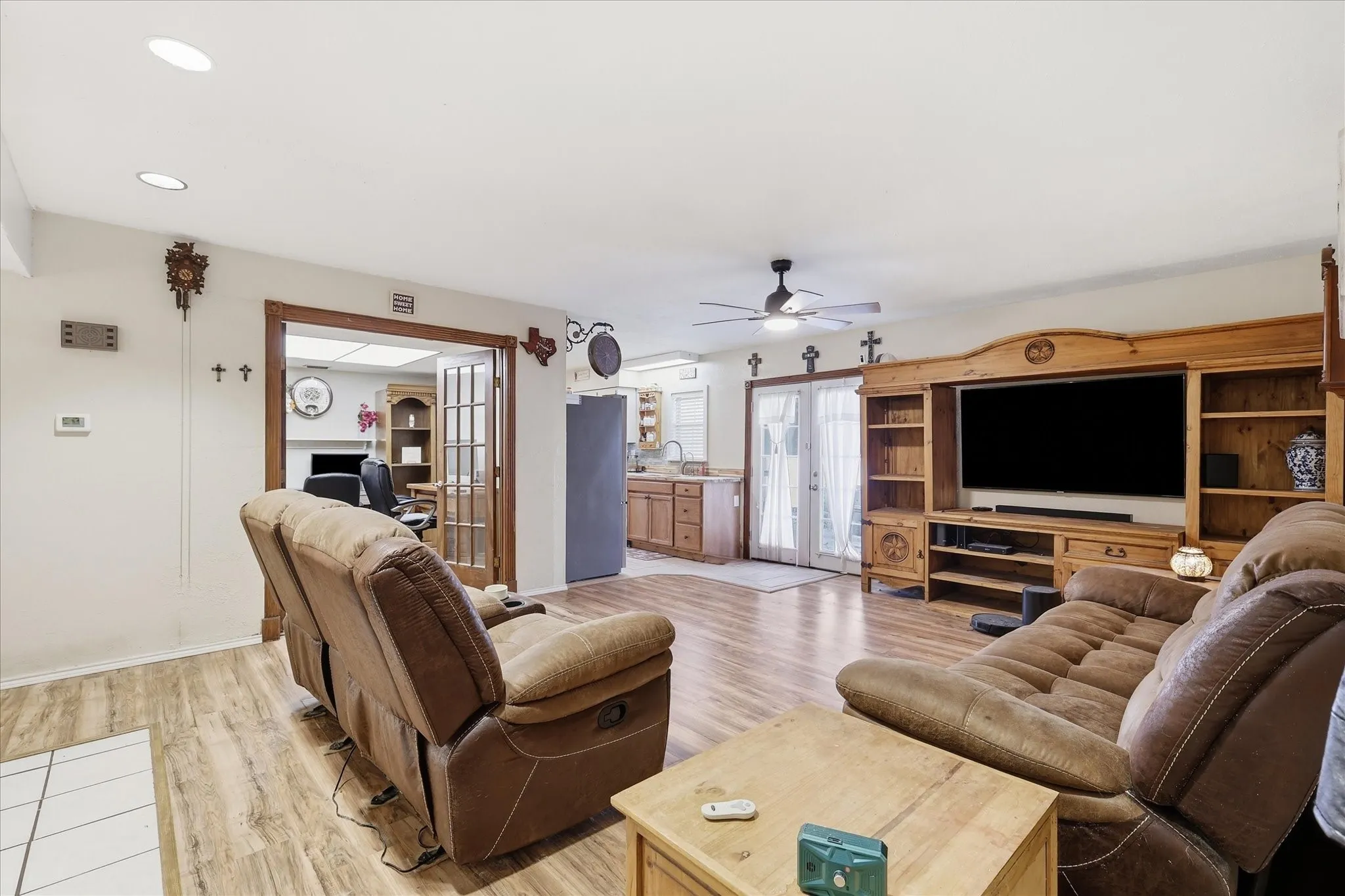 Living area with modern LED lighting, no carpet, and 3-year-old high-efficiency windows.
