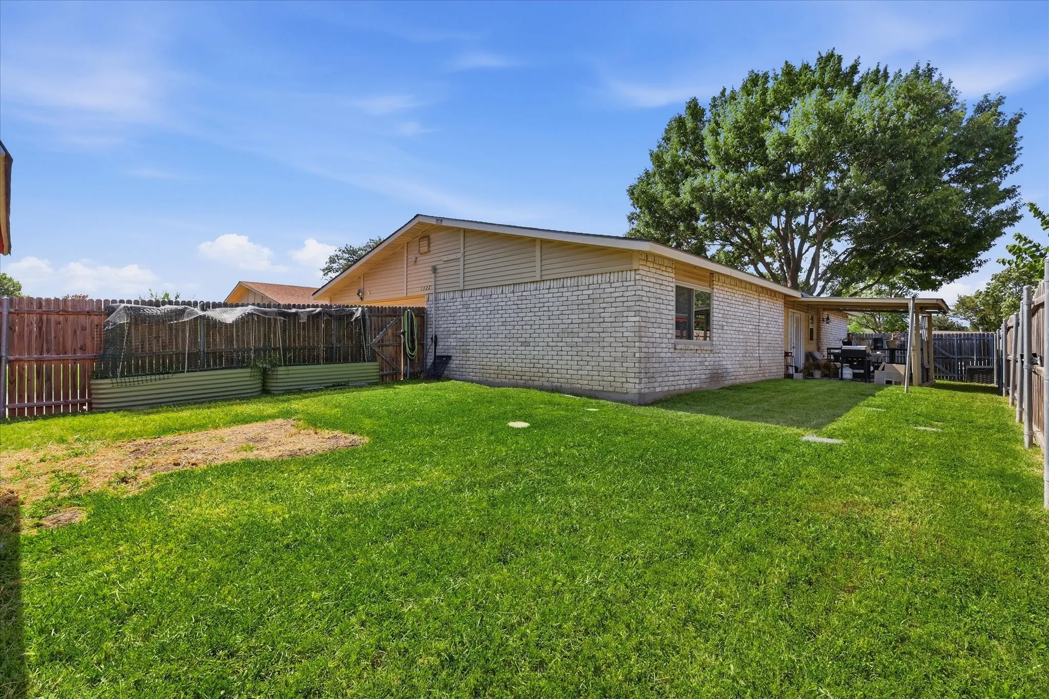 Backyard: large yard, garden containers can be removed or can stay. Covered back patio. New Fence. New roof.