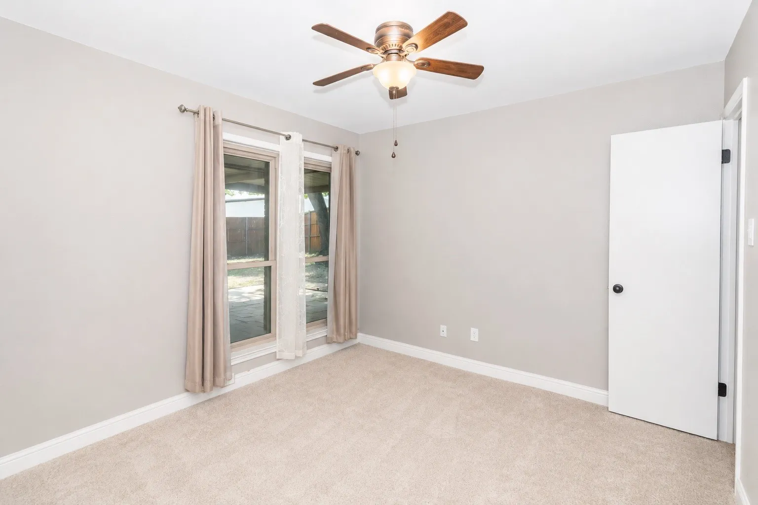 Light gray wall color with white trim