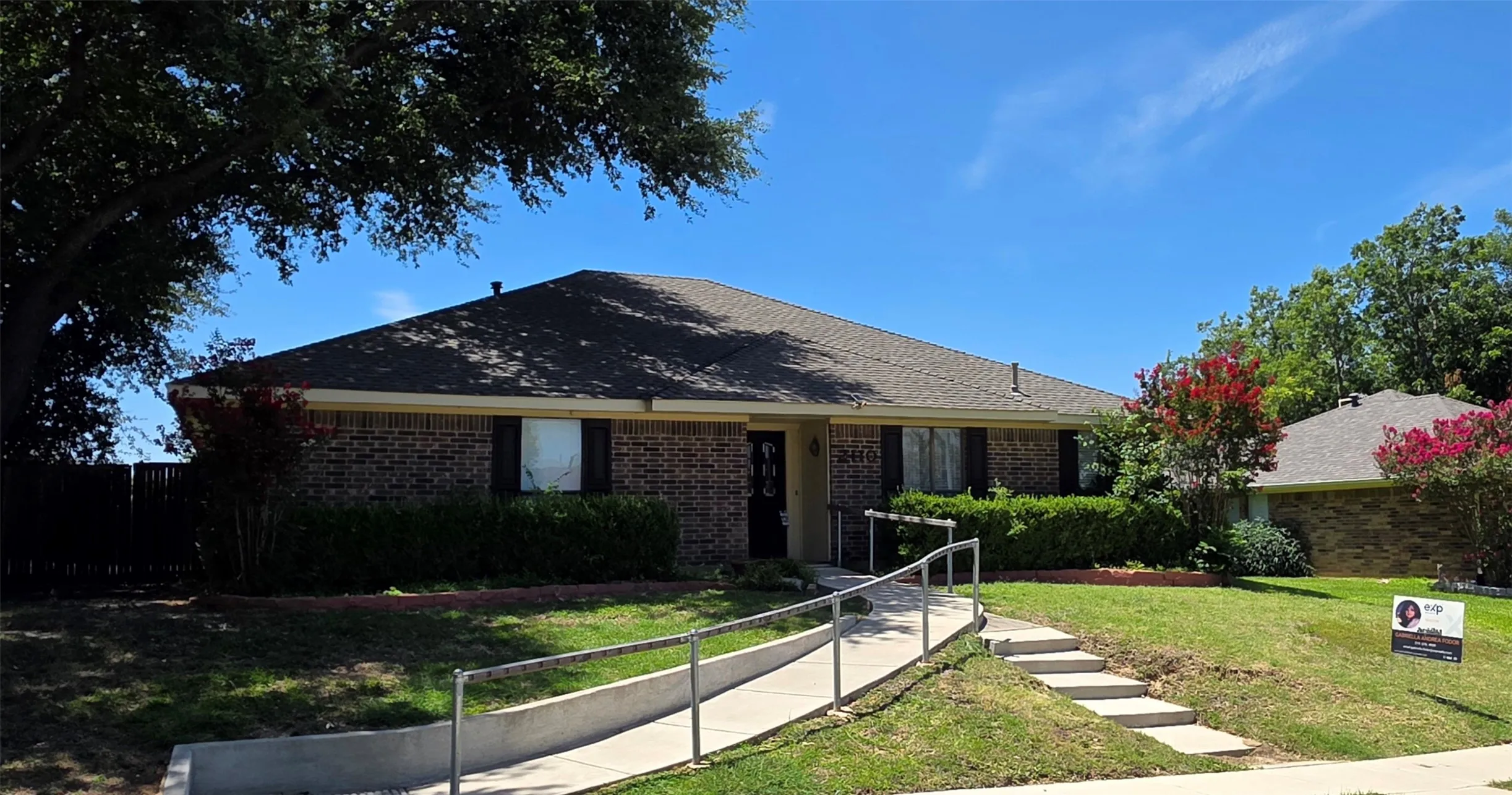 Brick exterior residence with a composition shingle roof