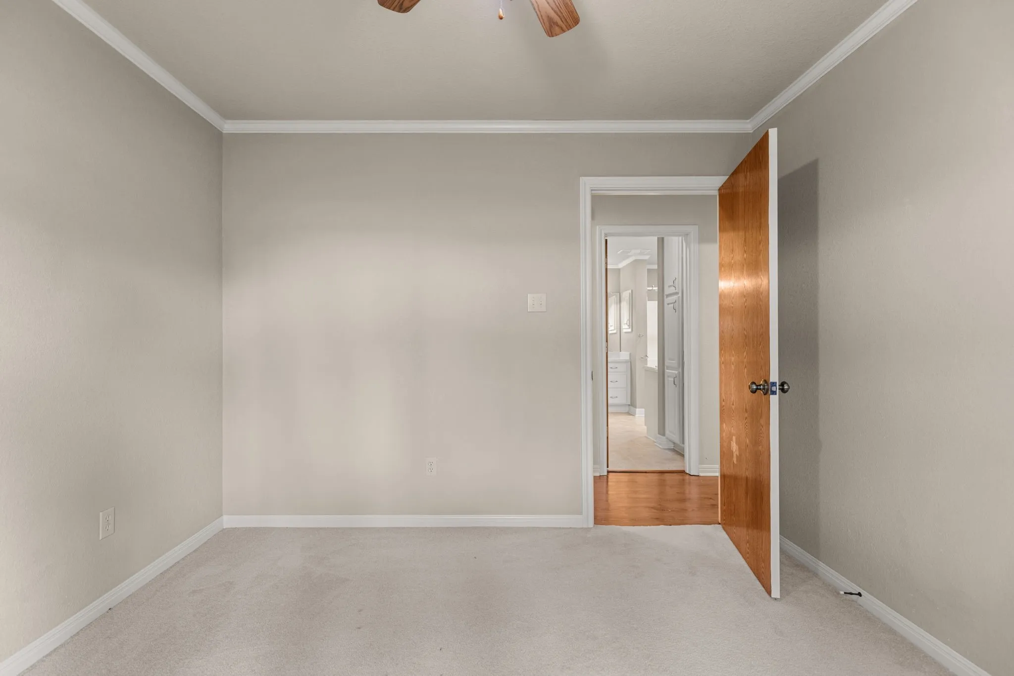 Neutral-toned walls paired with light-colored carpeting